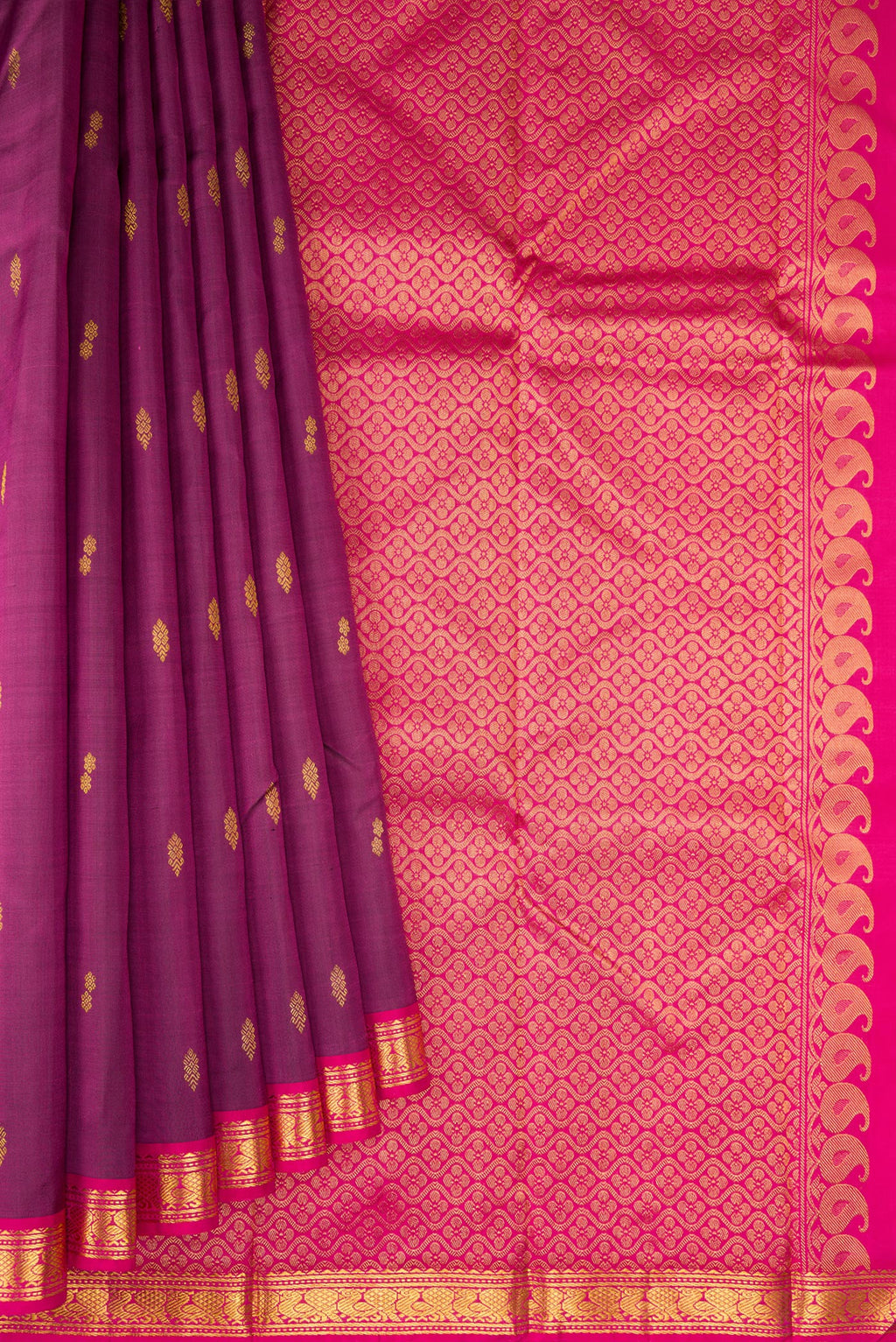 Pleats and pallu of Magenta Kanchipuram Silk Saree with Zari Butta on the body and Zari Border. 