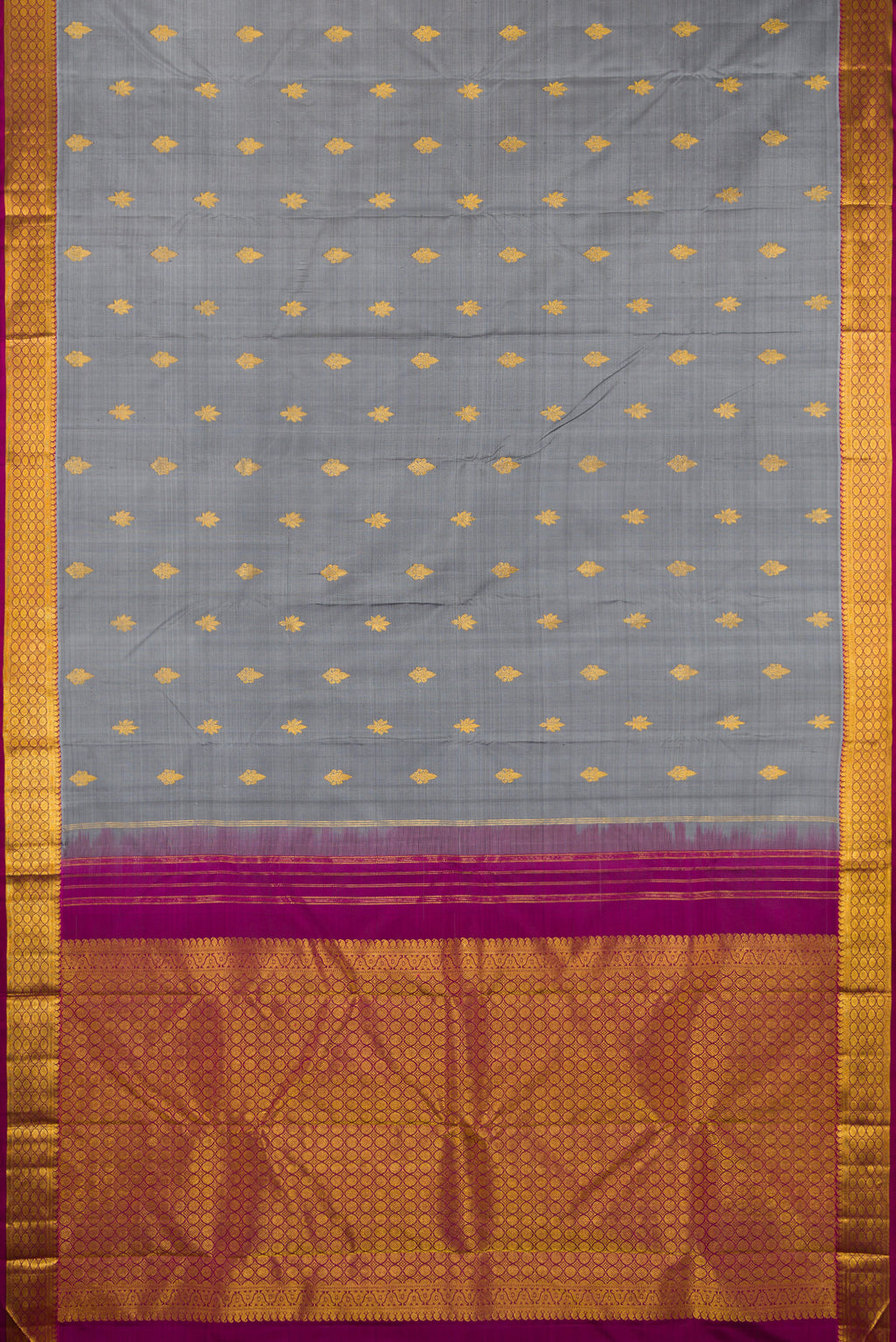 Flat view of Grey Kanchipuram Silk Saree with Zari Butta on the body and Zari Border. 