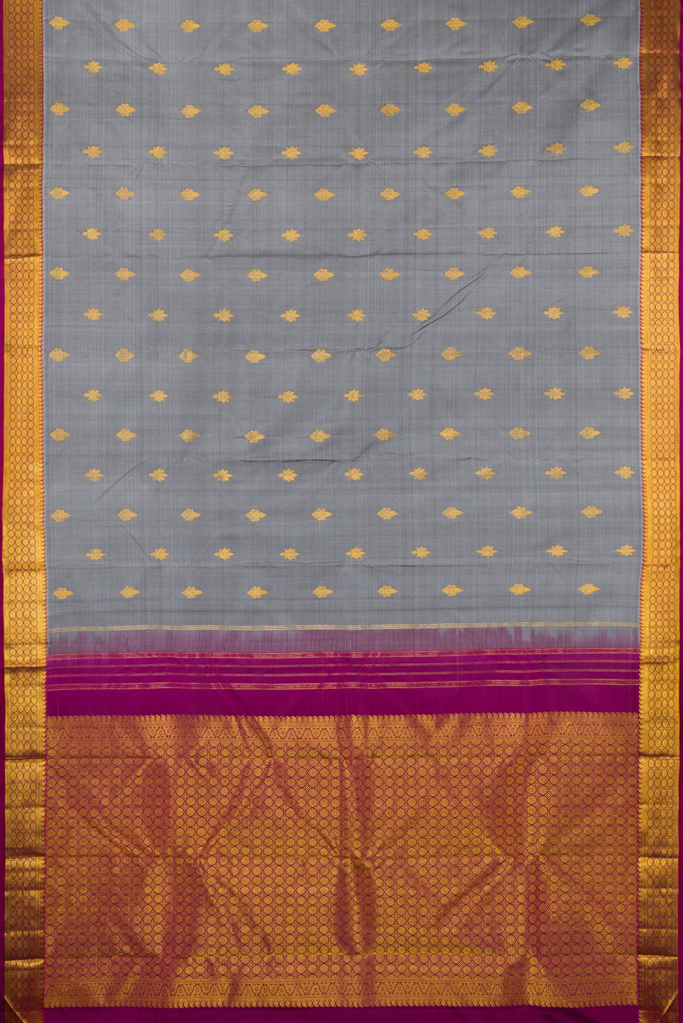 Flat view of Grey Kanchipuram Silk Saree with Zari Butta on the body and Zari Border. 