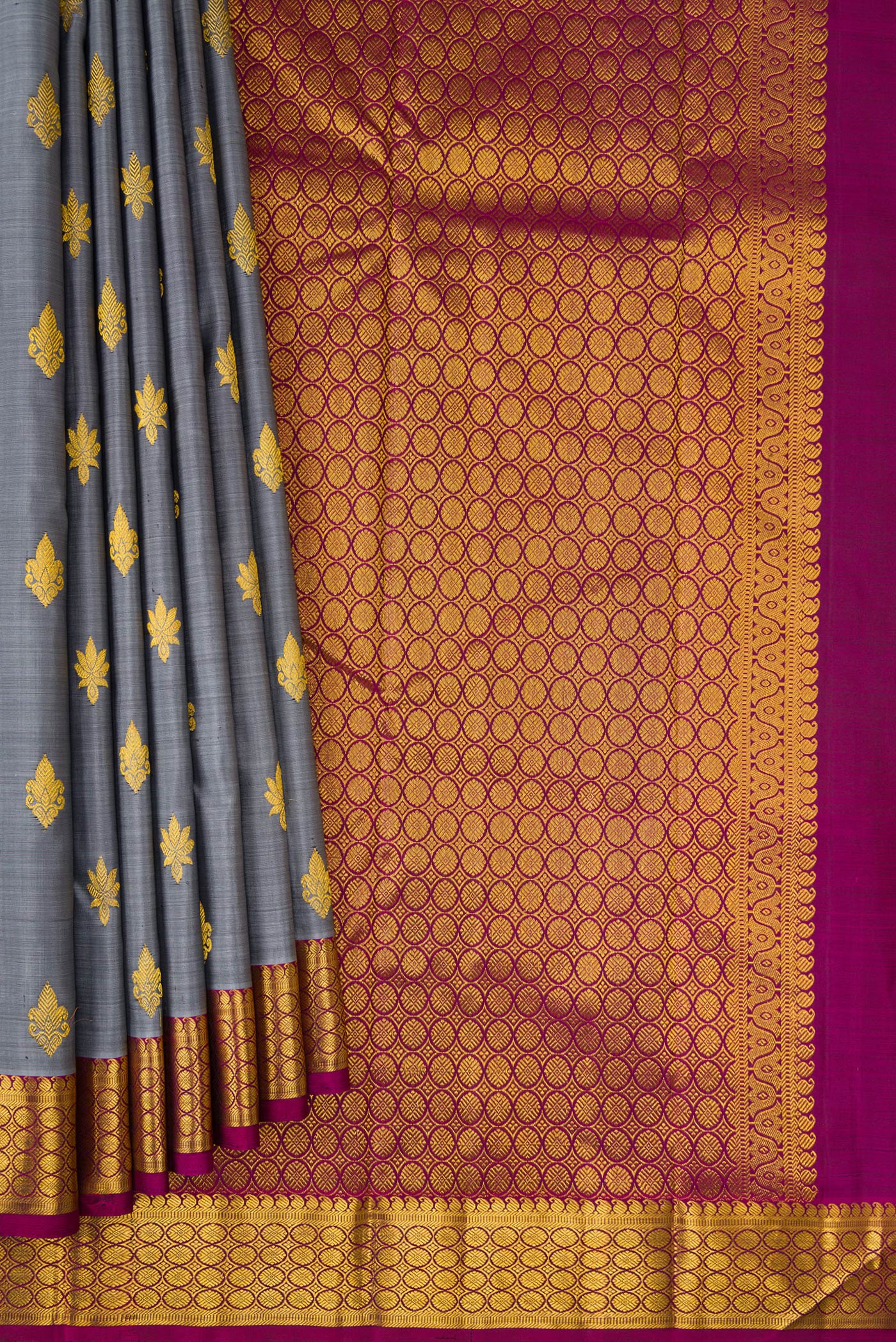 Pleats and pallu of Grey Kanchipuram Silk Saree with Zari Butta on the body and Zari Border. 