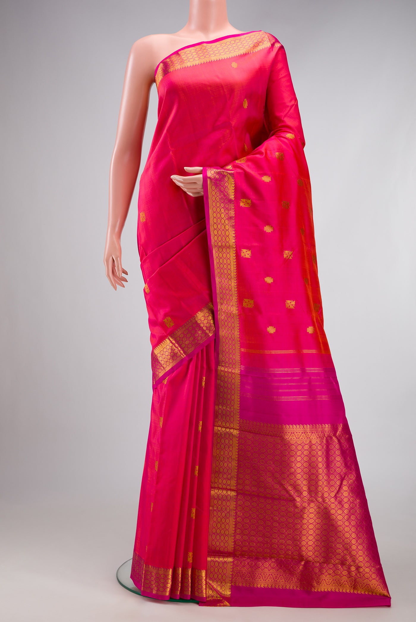 Pink Dual Tone Kanchipuram Silk Saree with Zari Butta on the body and Zari Border.  displayed on a mannequin