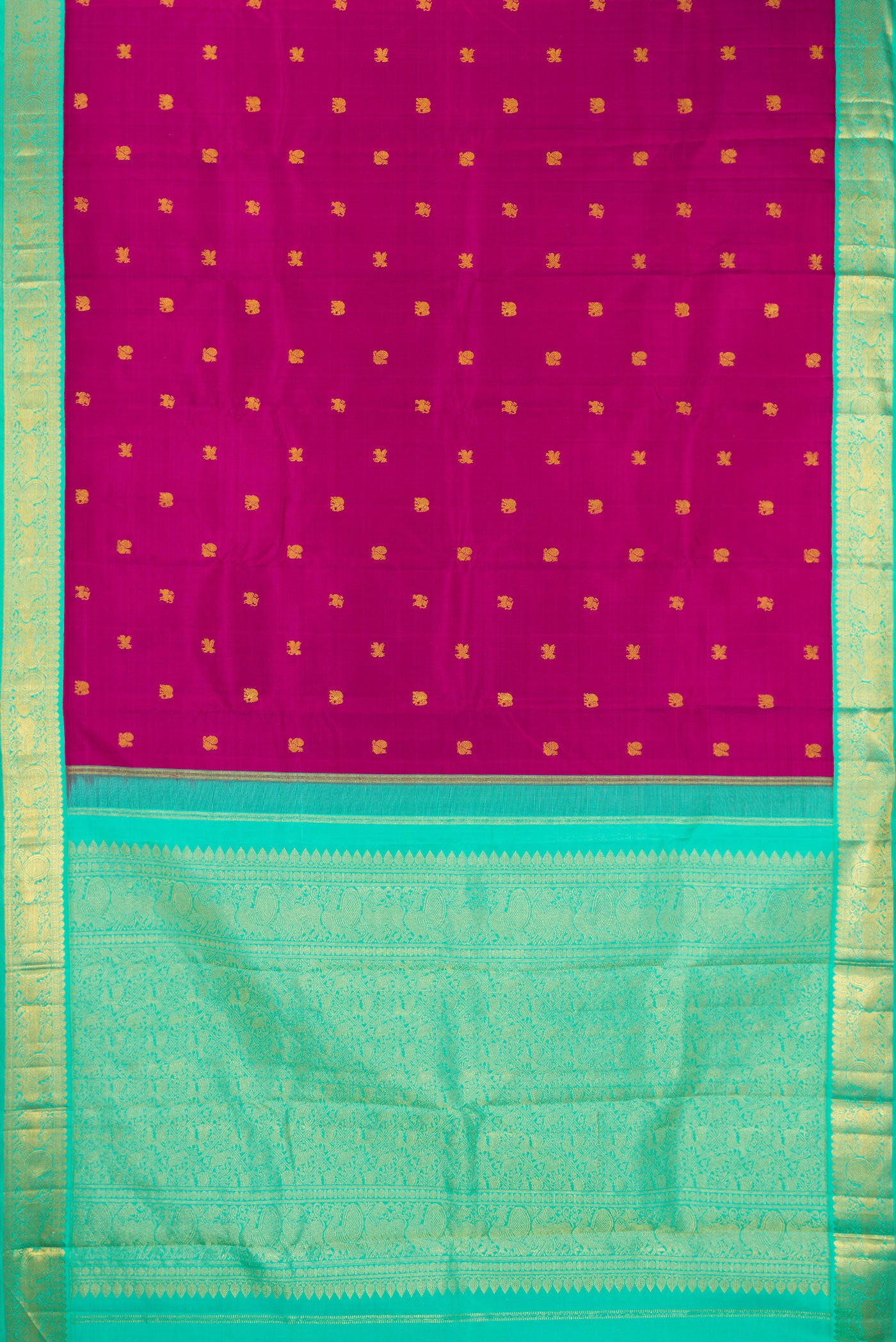 Flat view of Magenta Kanjivaram Silk Saree with Zari Butta on the body and Zari Border. 