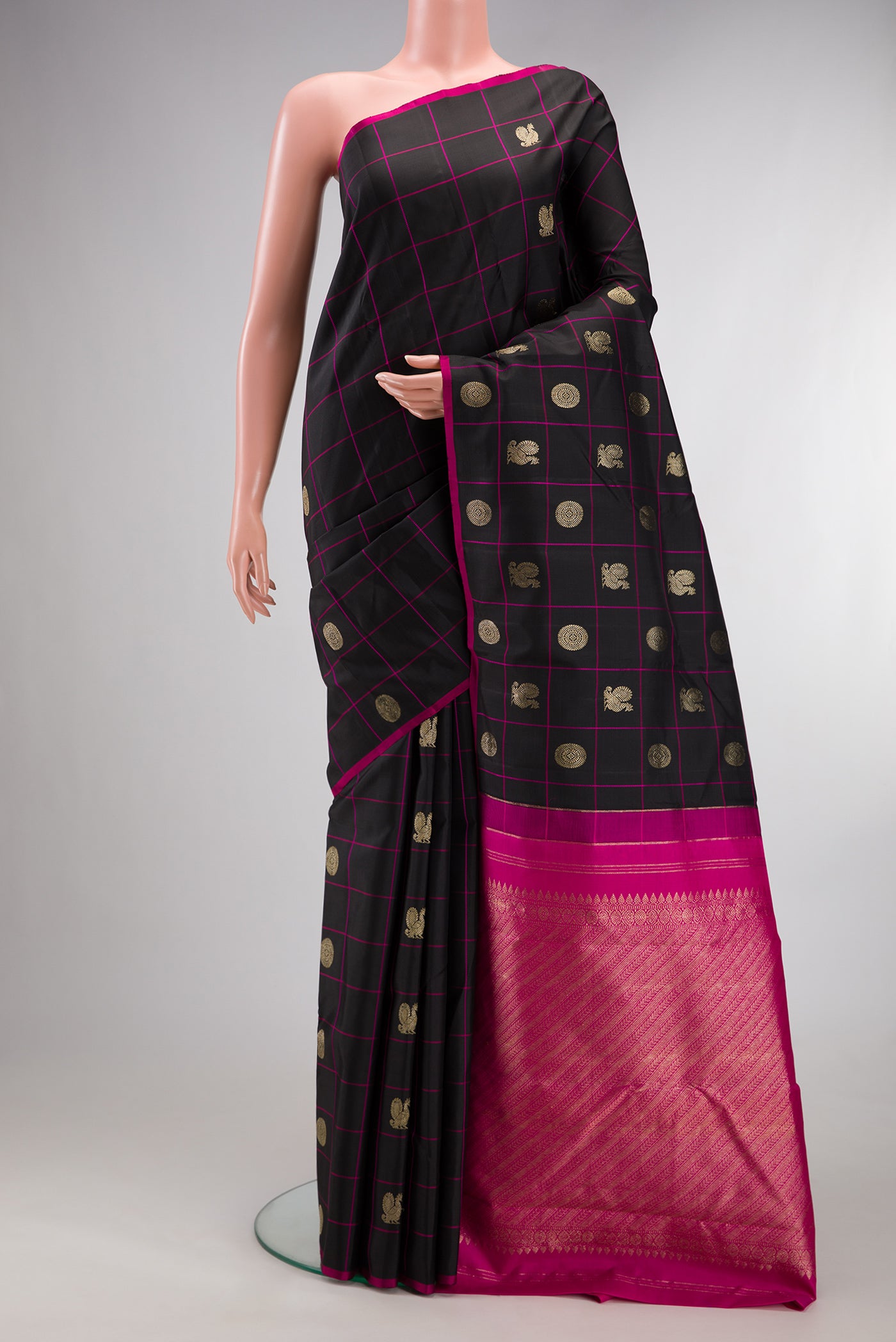Pure Silk Black Kanchipuram Saree with Checked design on the body and Without Border.  displayed on a mannequin