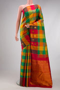 Multi Color Kanchipuram Silk Saree with Checked design on the body and Fancy Border.  displayed on a mannequin