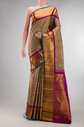 Pure Silk Brown Kanjivaram Saree with Zari Butta on the body and Zari Border.  displayed on a mannequin