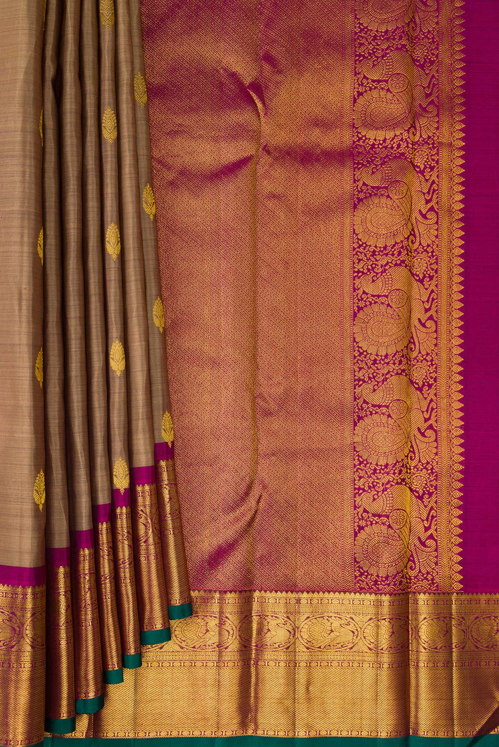 Pleats and pallu of Pure Silk Brown Kanjivaram Saree with Zari Butta on the body and Zari Border. 
