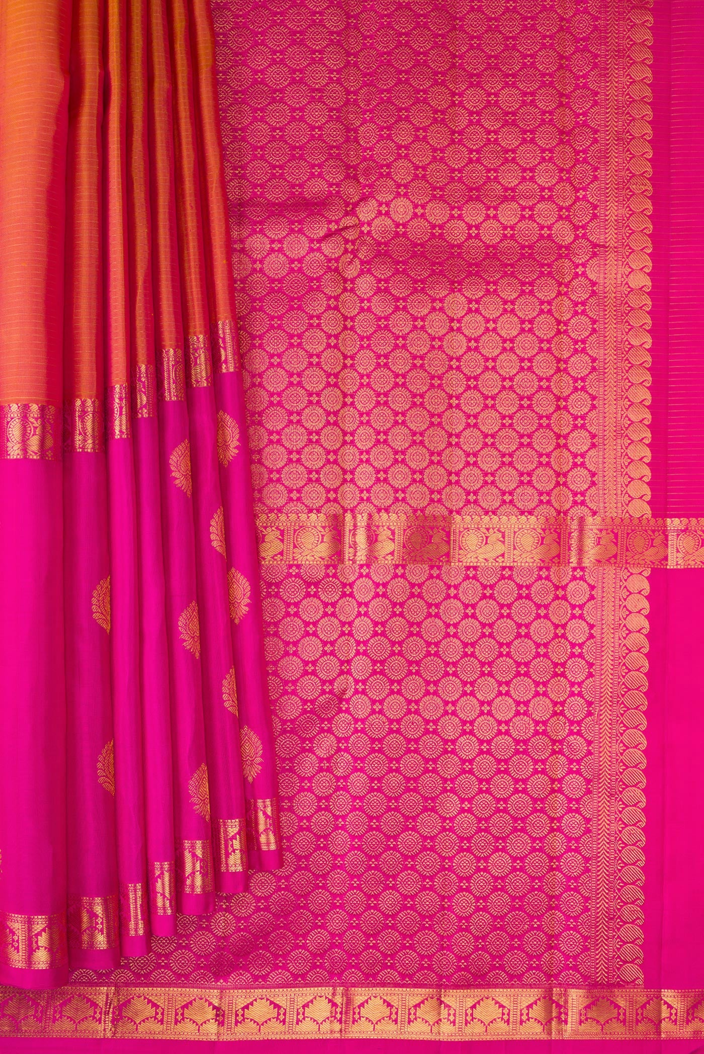 Pleats and pallu of Orange Kanjivaram Silk Saree with Stripes on the body and Ganga Jamuna Border. 