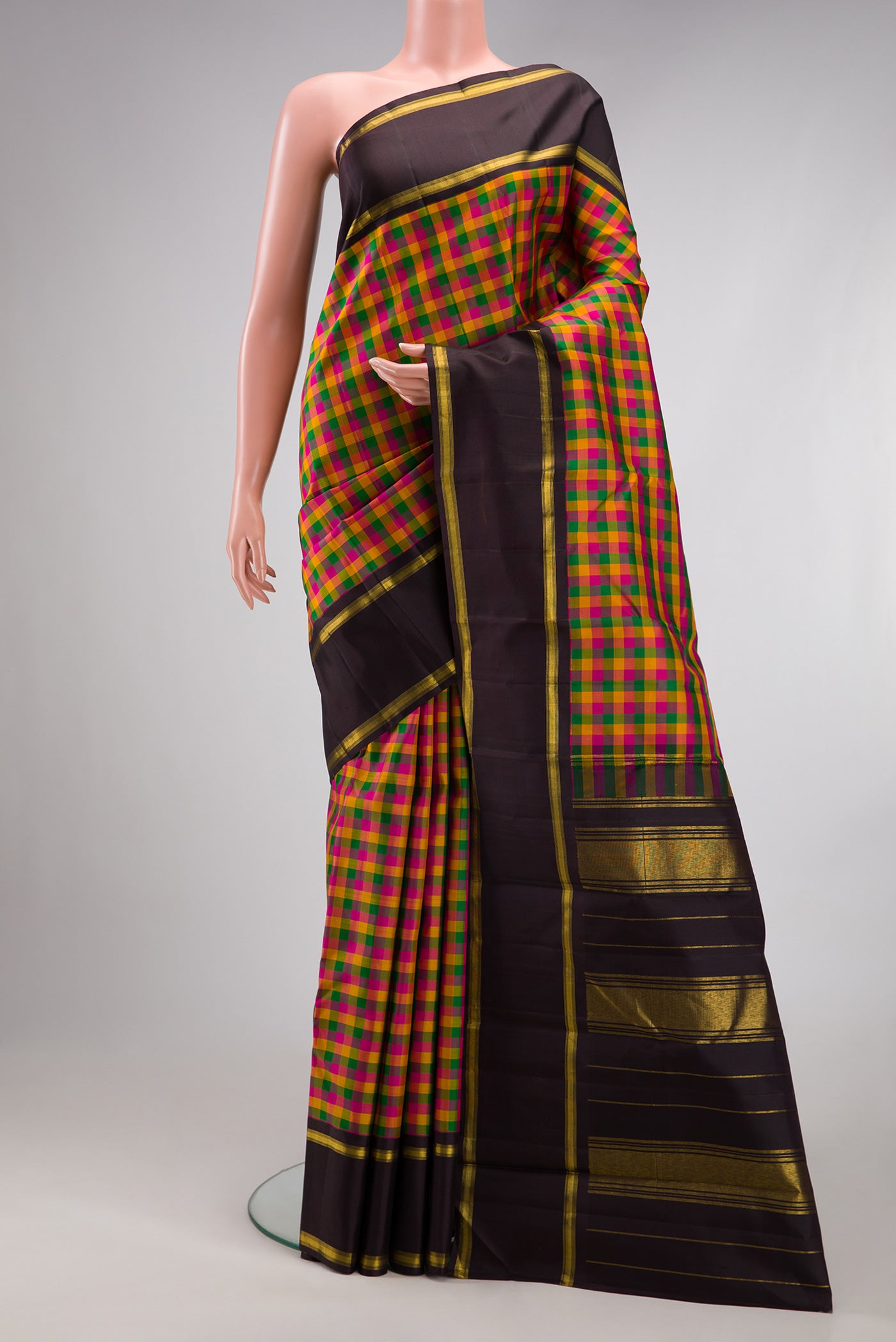Multi Color Kanjivaram Silk Saree with Checked design on the body and Zari Border.  displayed on a mannequin