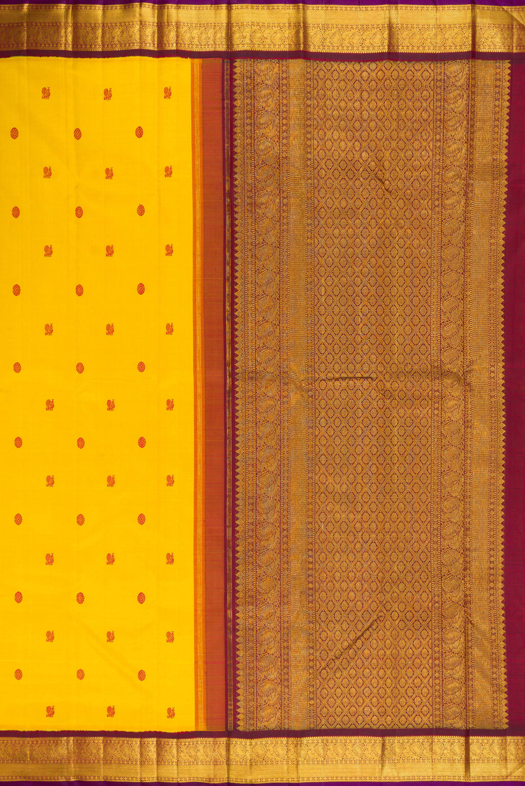 Close up image of the pallu of Yellow Kanjivaram Silk Saree with Thread Butta on the body and Zari Border. 