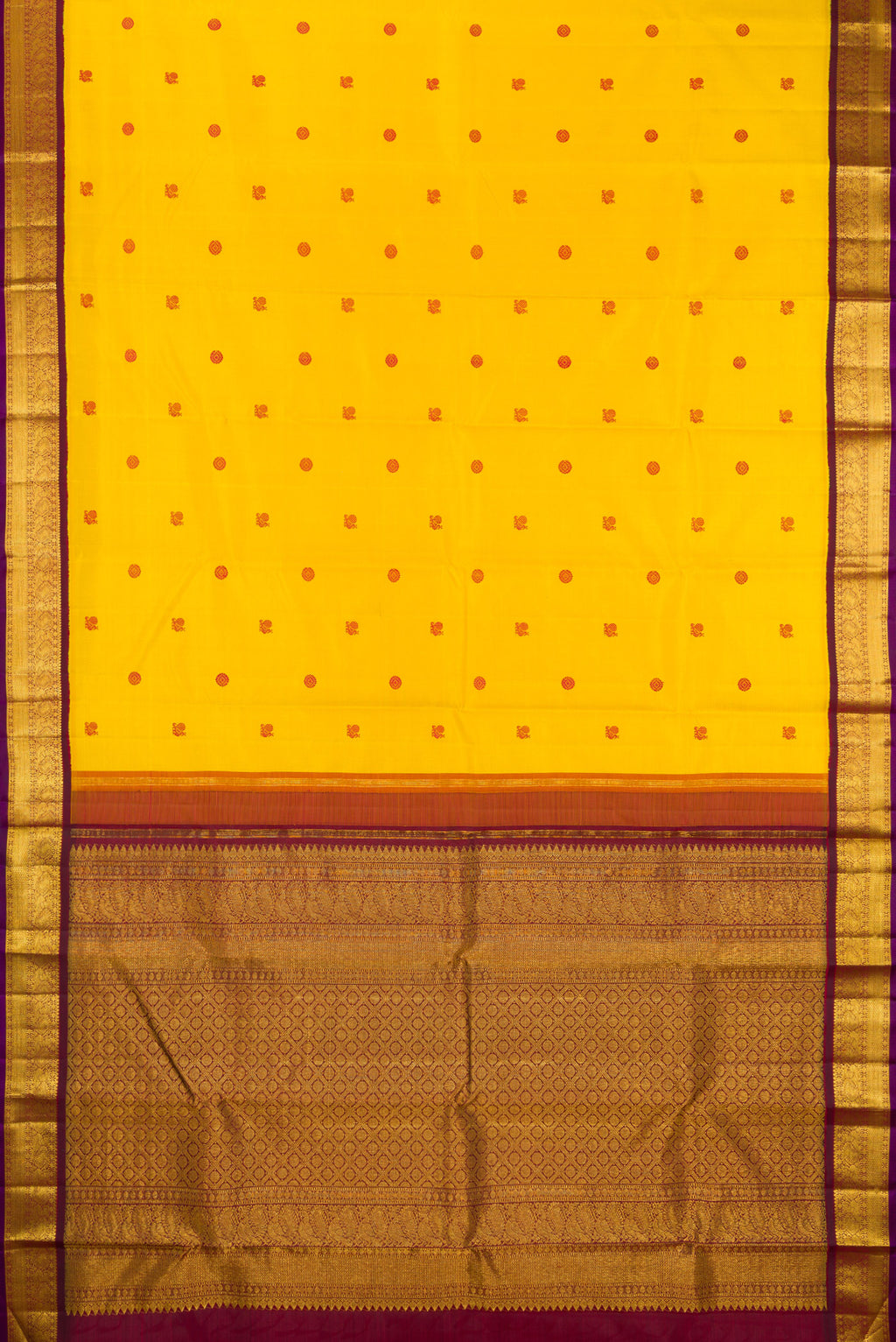 Flat view of Yellow Kanjivaram Silk Saree with Thread Butta on the body and Zari Border. 