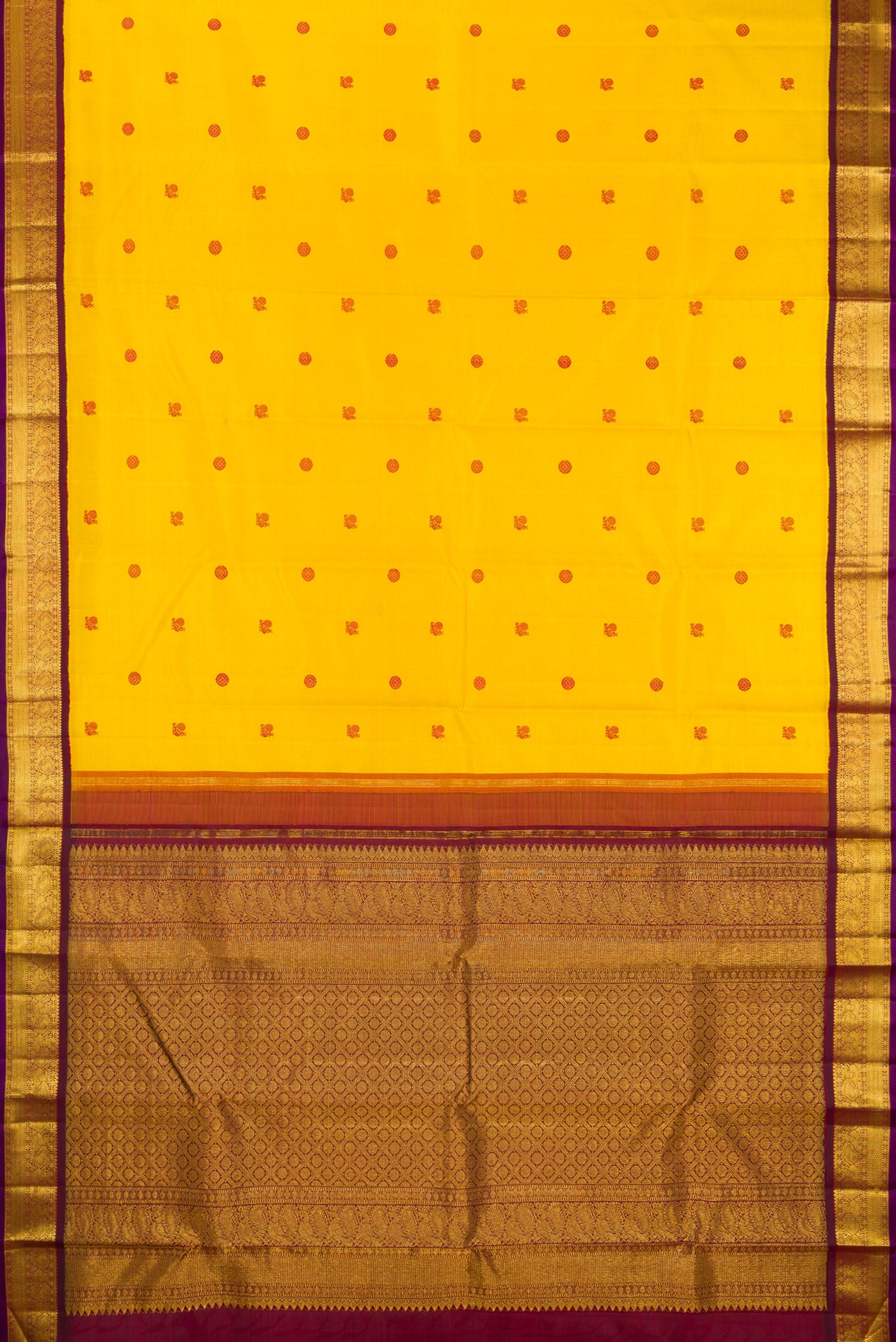 Flat view of Yellow Kanjivaram Silk Saree with Thread Butta on the body and Zari Border. 