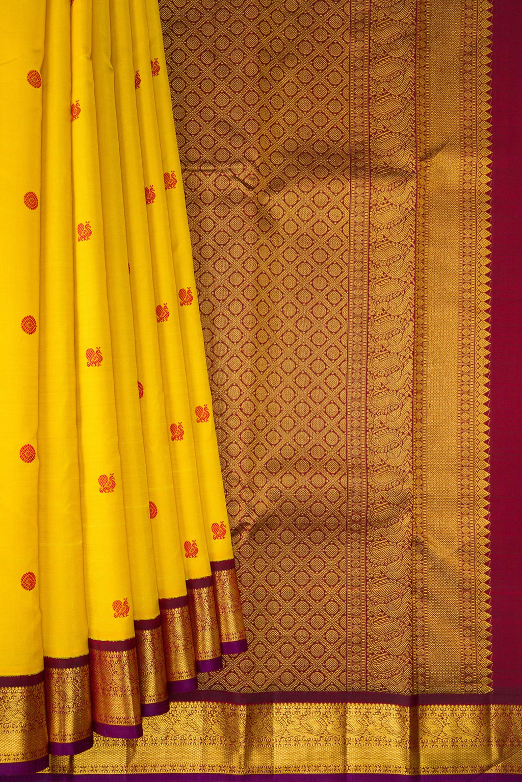 Pleats and pallu of Yellow Kanjivaram Silk Saree with Thread Butta on the body and Zari Border. 
