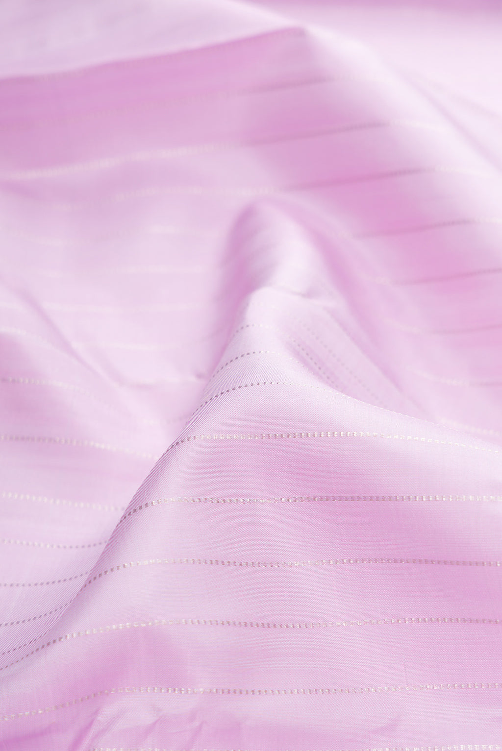 Close up of Lavender Kanjivaram Silk Saree with Stripes on the body and Without Border.  displaying folds