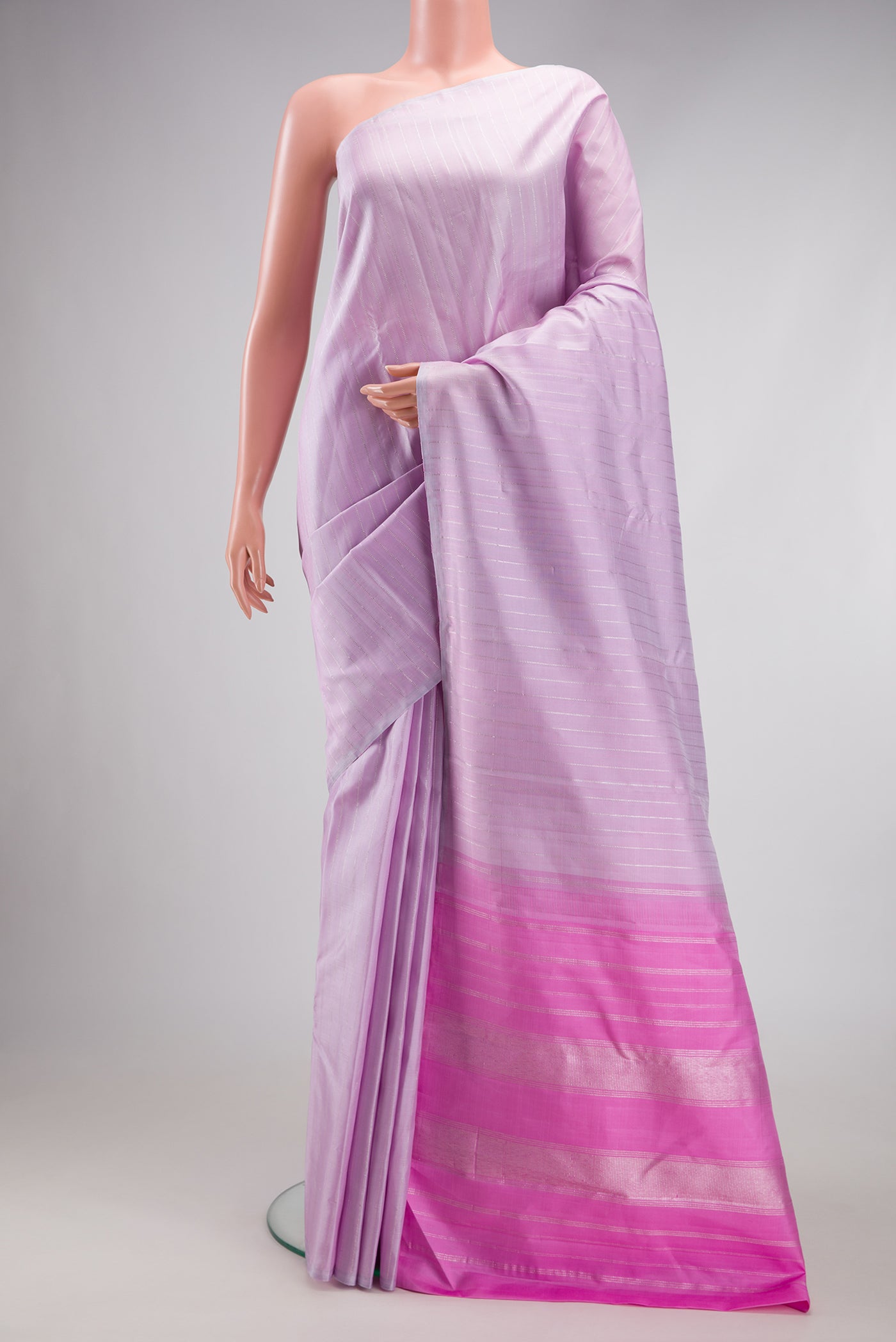 Lavender Kanjivaram Silk Saree with Stripes on the body and Without Border.  displayed on a mannequin