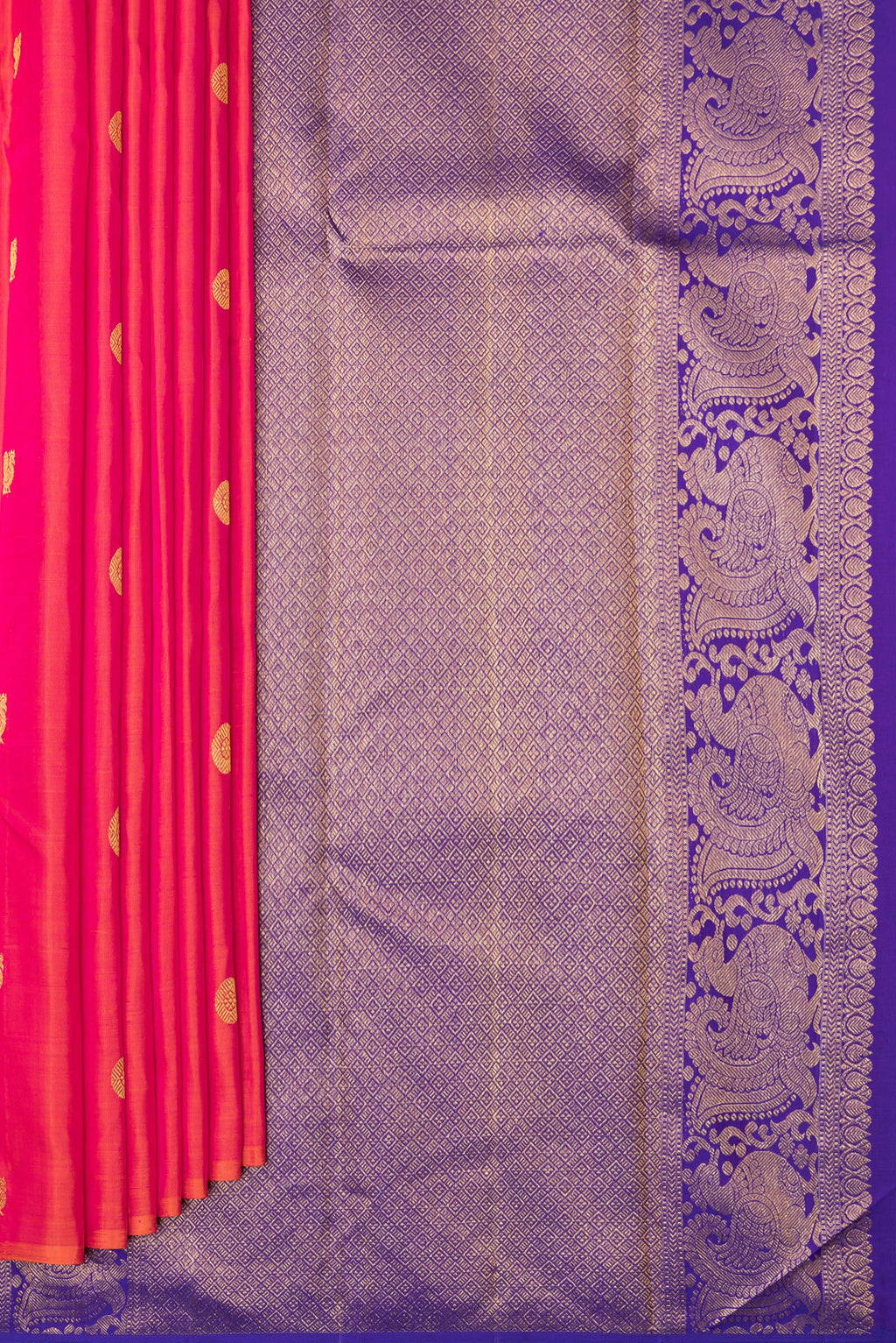 Pleats and pallu of Pure Silk Coral Dual Tone Kanchipuram Saree with Zari Butta on the body and Without Border. 