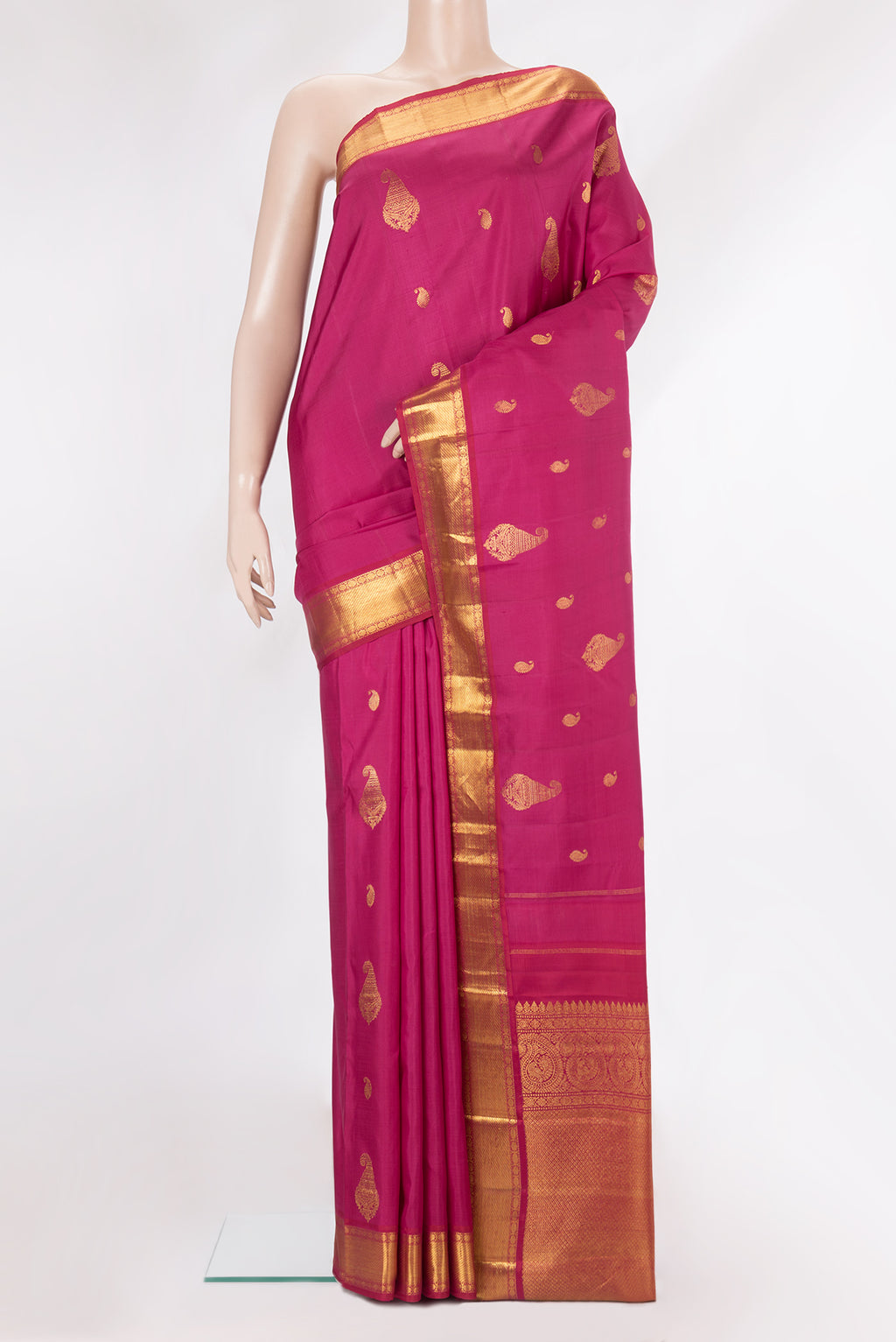 Pure Silk Pink Kanjivaram Saree with Zari Butta on the body and Zari Border.  displayed on a mannequin