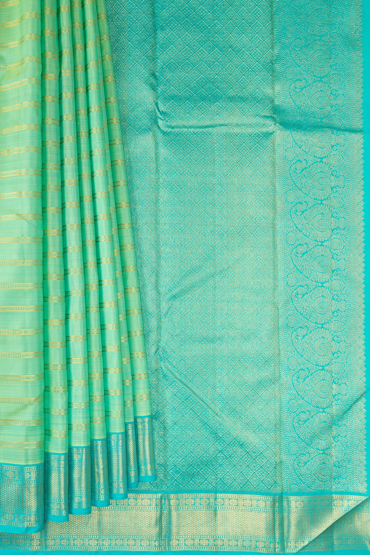 Pleats and pallu of Pista Green Kanjivaram Silk Saree with Stripes on the body and Zari Border. 
