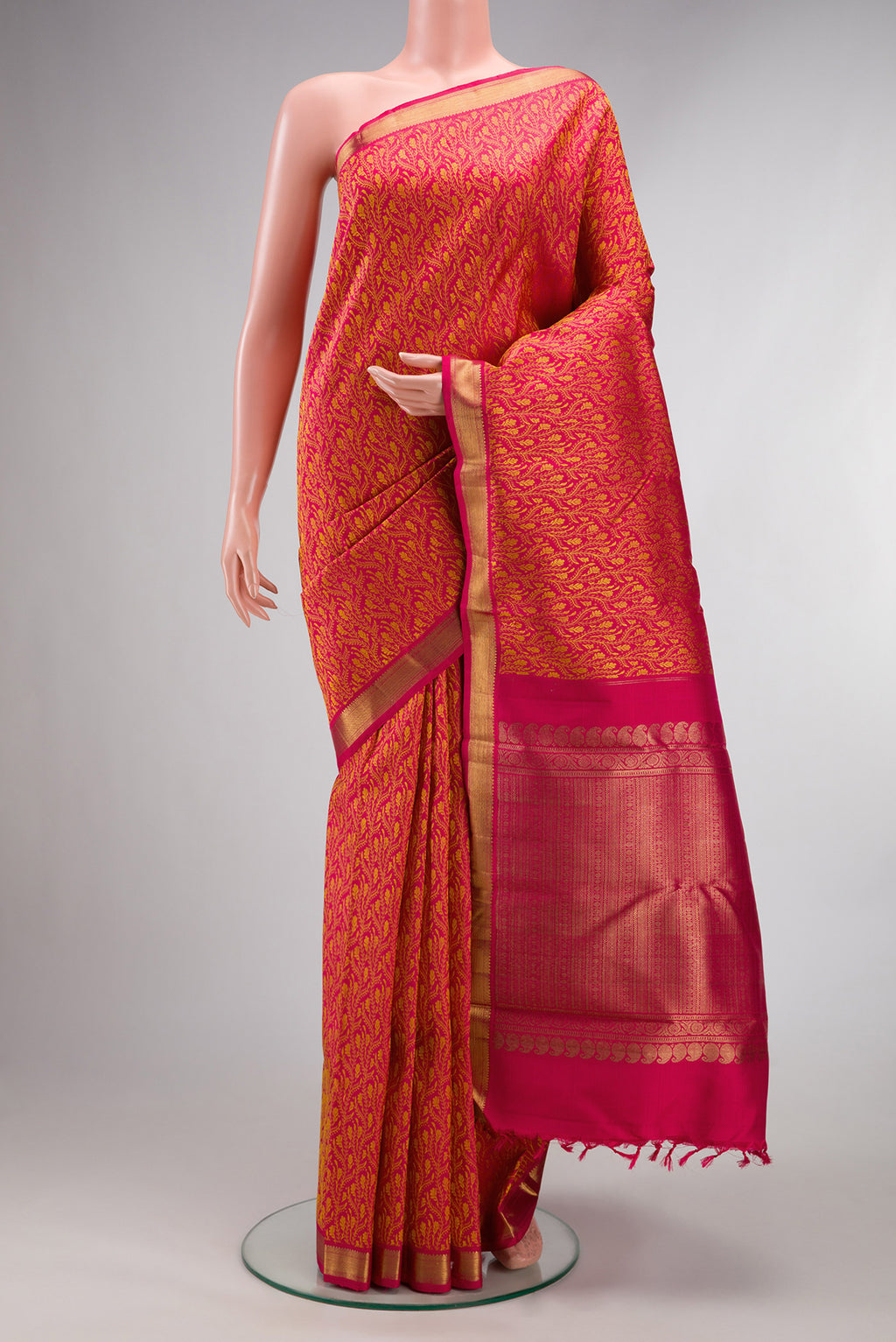 Pure Silk Pink Dual Tone Kanchipuram Saree with Jacquard design on the body and Zari Border.  displayed on a mannequin