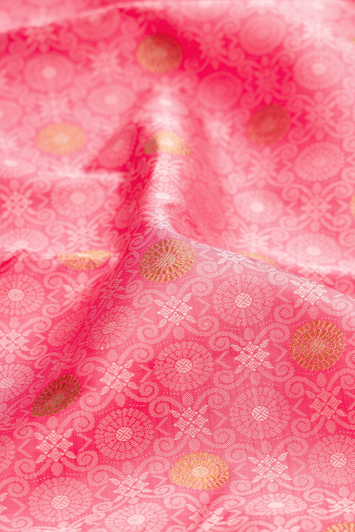Close up of Pure Silk Pink Kanchipuram Saree with Jacquard design on the body and Zari Border.  displaying folds