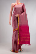 Rose Gold Kanjivaram Silk Saree with Plain Body and Zari Border.  displayed on a mannequin