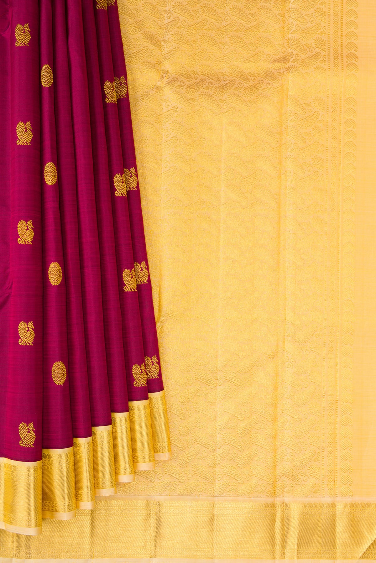 Pleats and pallu of Magenta Kanjivaram Silk Saree with Zari Butta on the body and Zari Border. 
