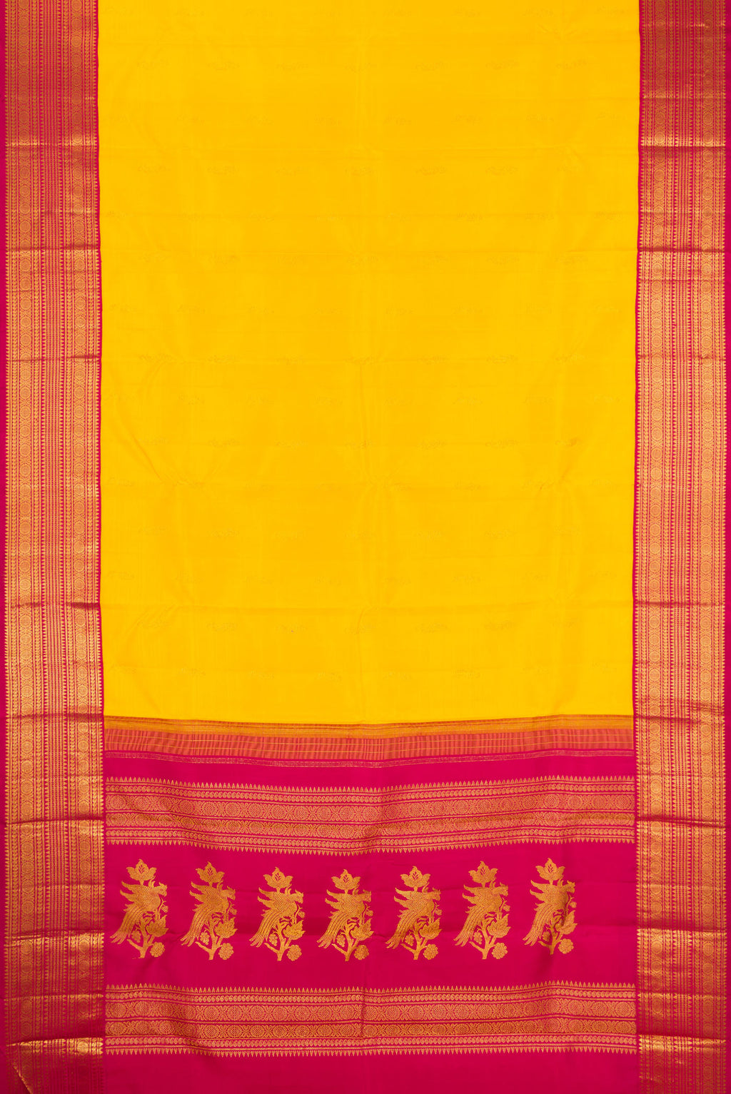 Flat view of Yellow Kanjivaram Silk Saree with Zari Butta on the body and Zari Border. 