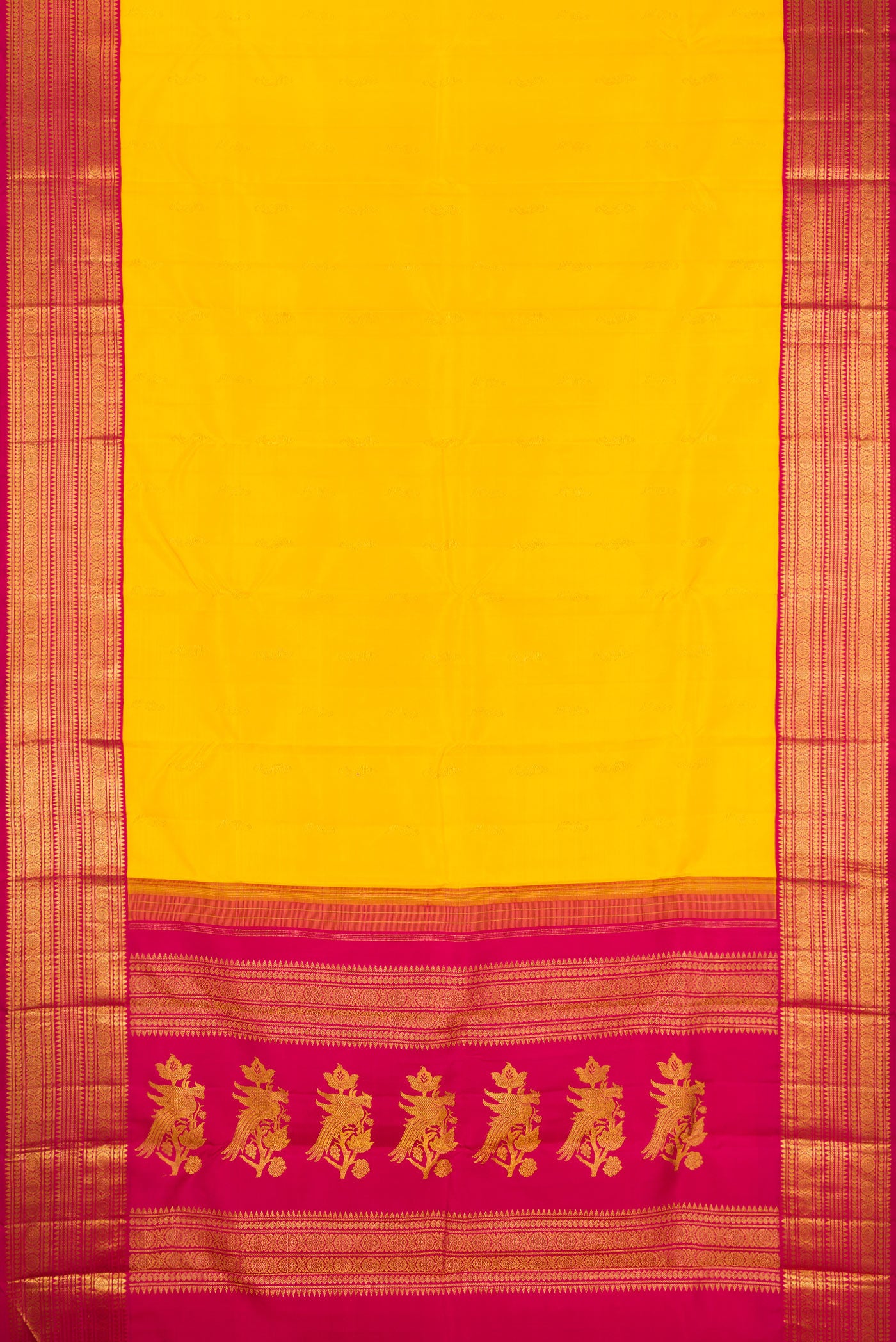 Flat view of Yellow Kanjivaram Silk Saree with Zari Butta on the body and Zari Border. 