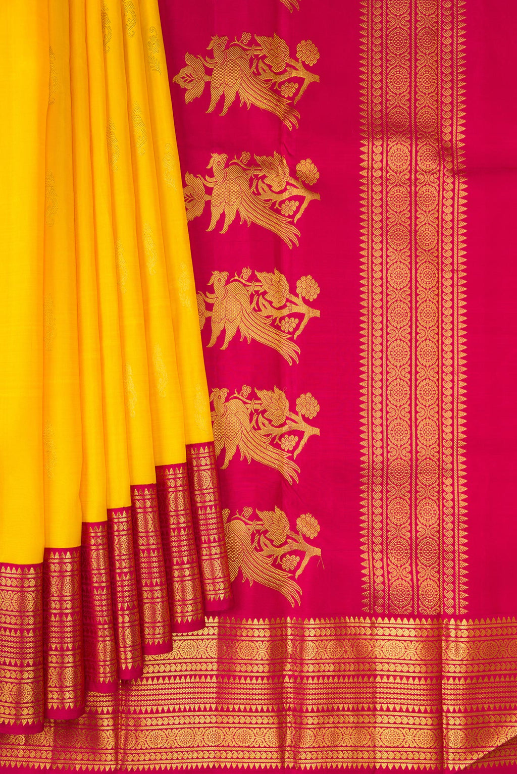 Pleats and pallu of Yellow Kanjivaram Silk Saree with Zari Butta on the body and Zari Border. 