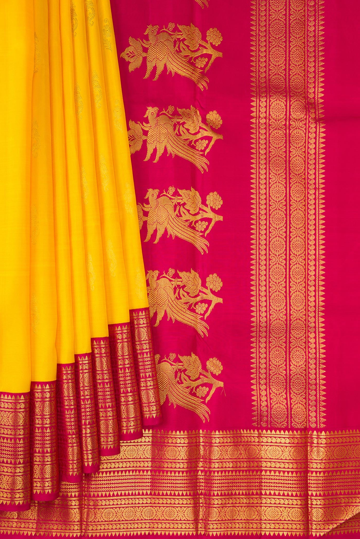 Pleats and pallu of Yellow Kanjivaram Silk Saree with Zari Butta on the body and Zari Border. 