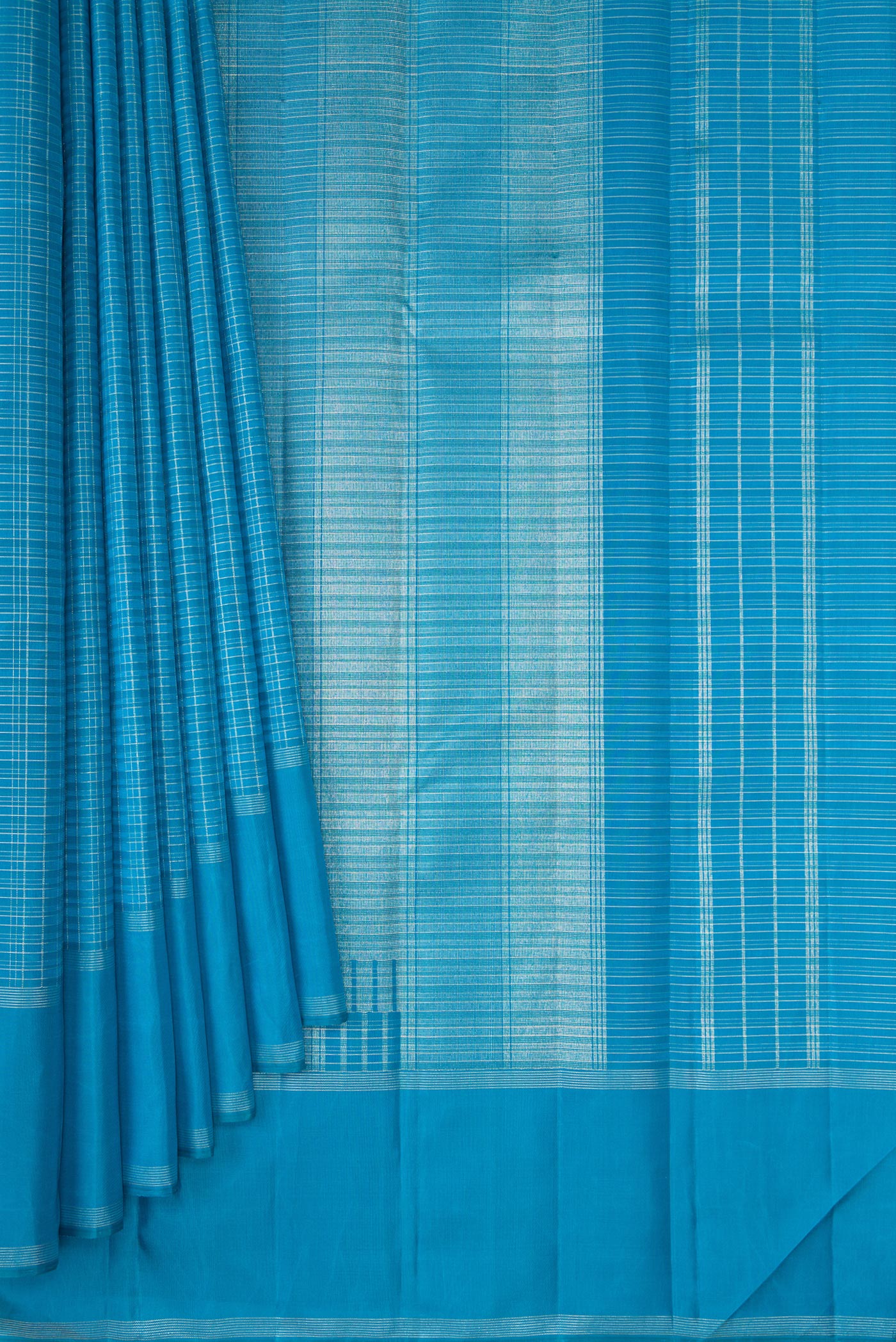 Pleats and pallu of Sky Blue Kanchipuram Silk Saree with Checked design on the body and Zari Border. 