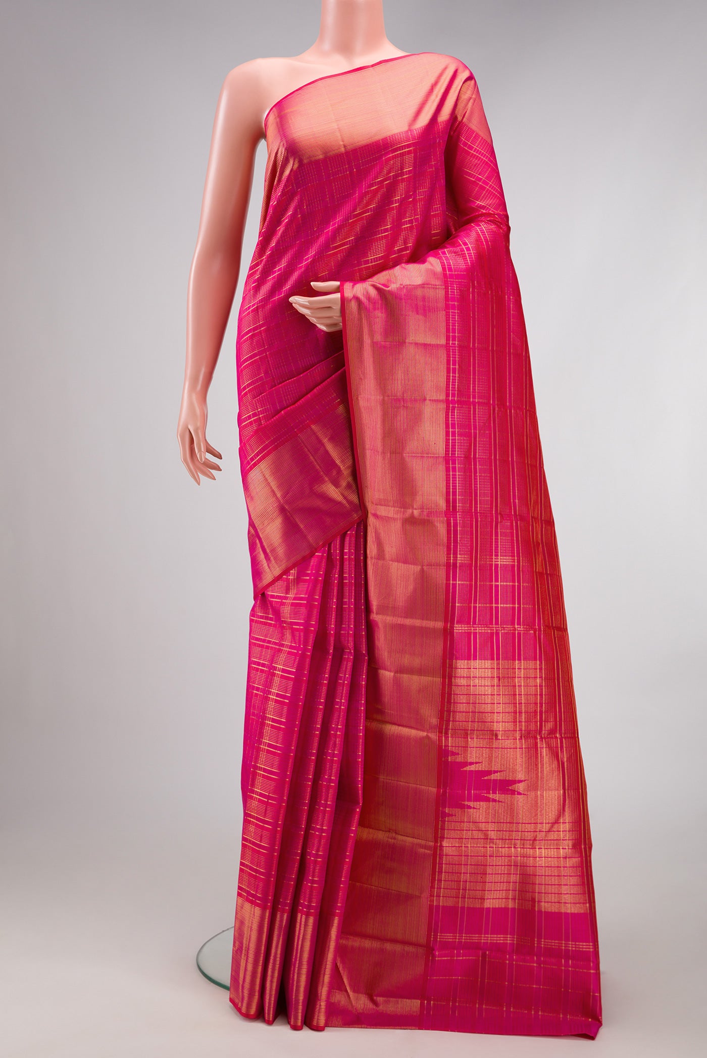 Dark Pink Kanjivaram Silk Saree with Checked design on the body and Zari Border.  displayed on a mannequin