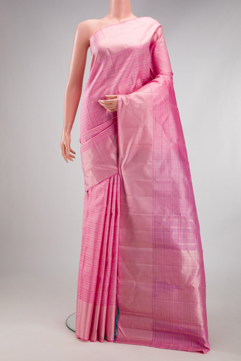 Rose pink Kanjivaram Silk Saree with Checked design on the body and Zari Border.  displayed on a mannequin