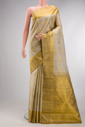 Pure Silk Beige Kanjivaram Saree with Checked design on the body and Zari Border.  displayed on a mannequin