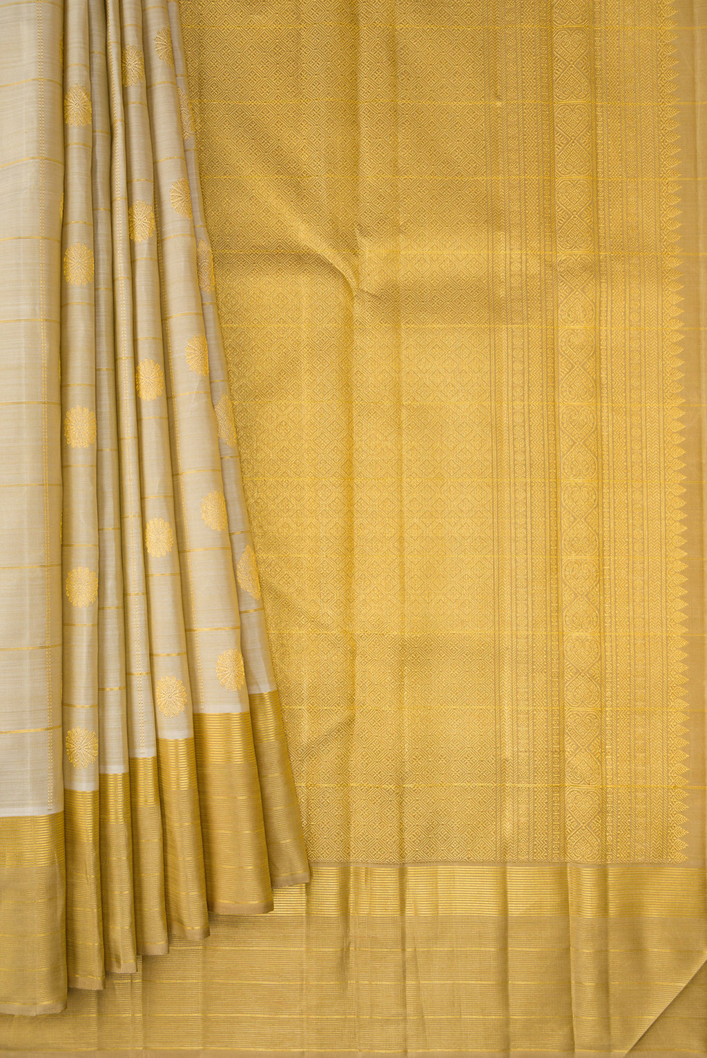 Pleats and pallu of Pure Silk Beige Kanjivaram Saree with Checked design on the body and Zari Border. 