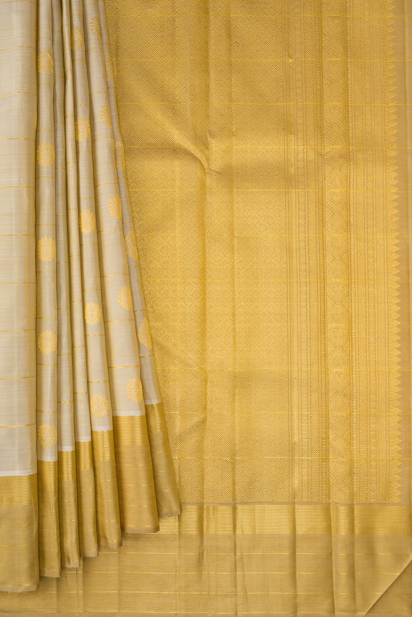Pleats and pallu of Pure Silk Beige Kanjivaram Saree with Checked design on the body and Zari Border. 
