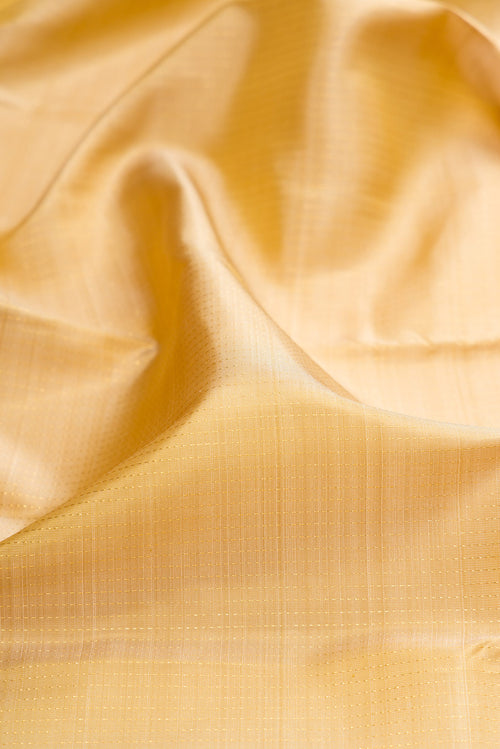 Close up of Beige Kanjivaram Silk Saree with Stripes on the body and Zari Border.  displaying folds