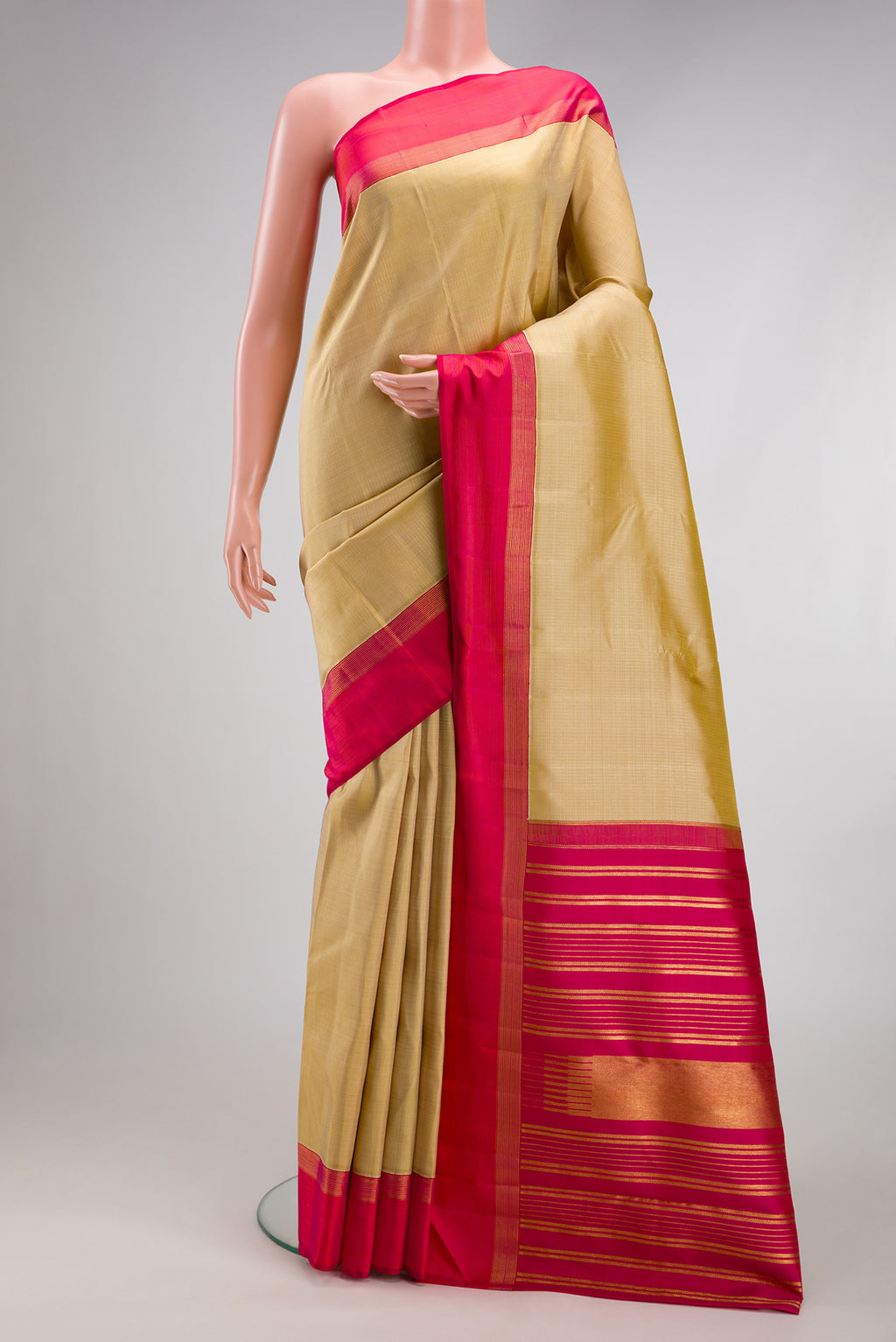 Beige Kanjivaram Silk Saree with Stripes on the body and Zari Border.  displayed on a mannequin