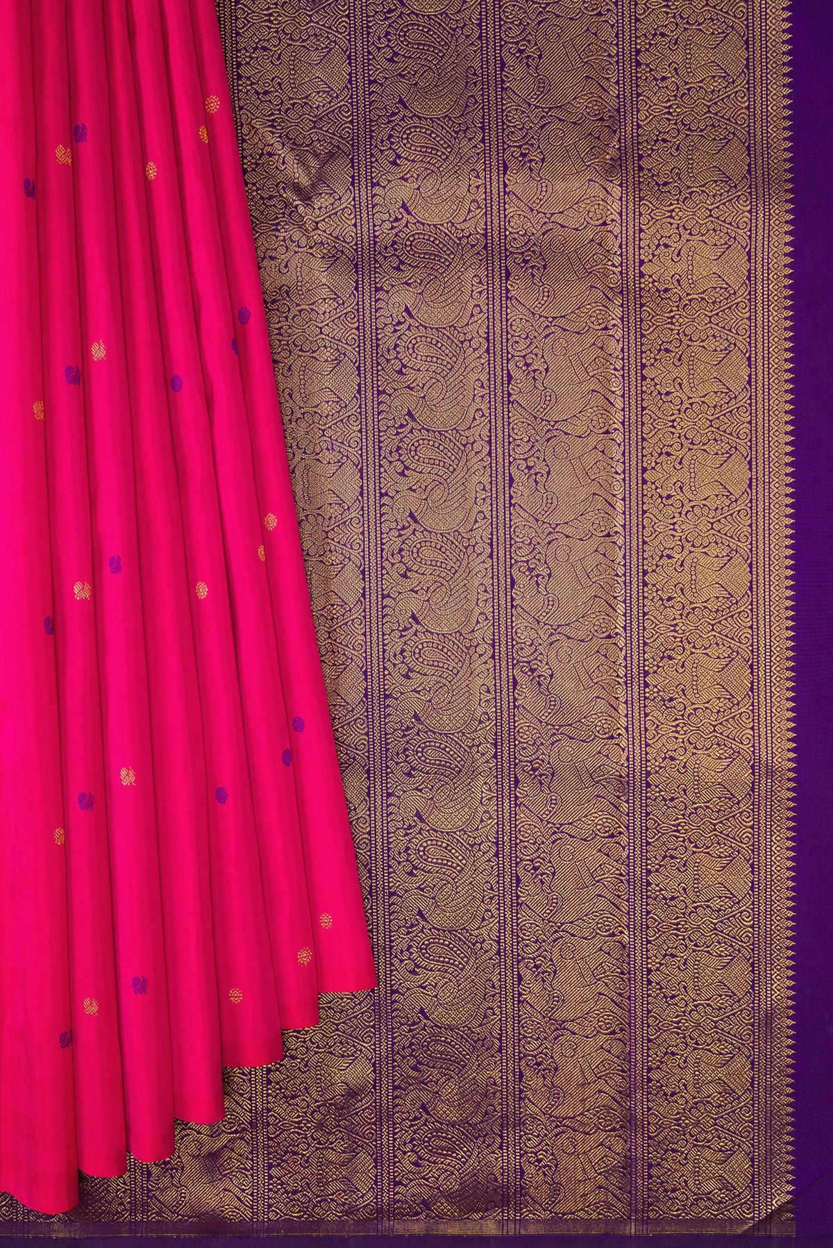 Pleats and pallu of Pink Kanjivaram Silk Saree with Zari And Thread Butta on the body and Without Border. 