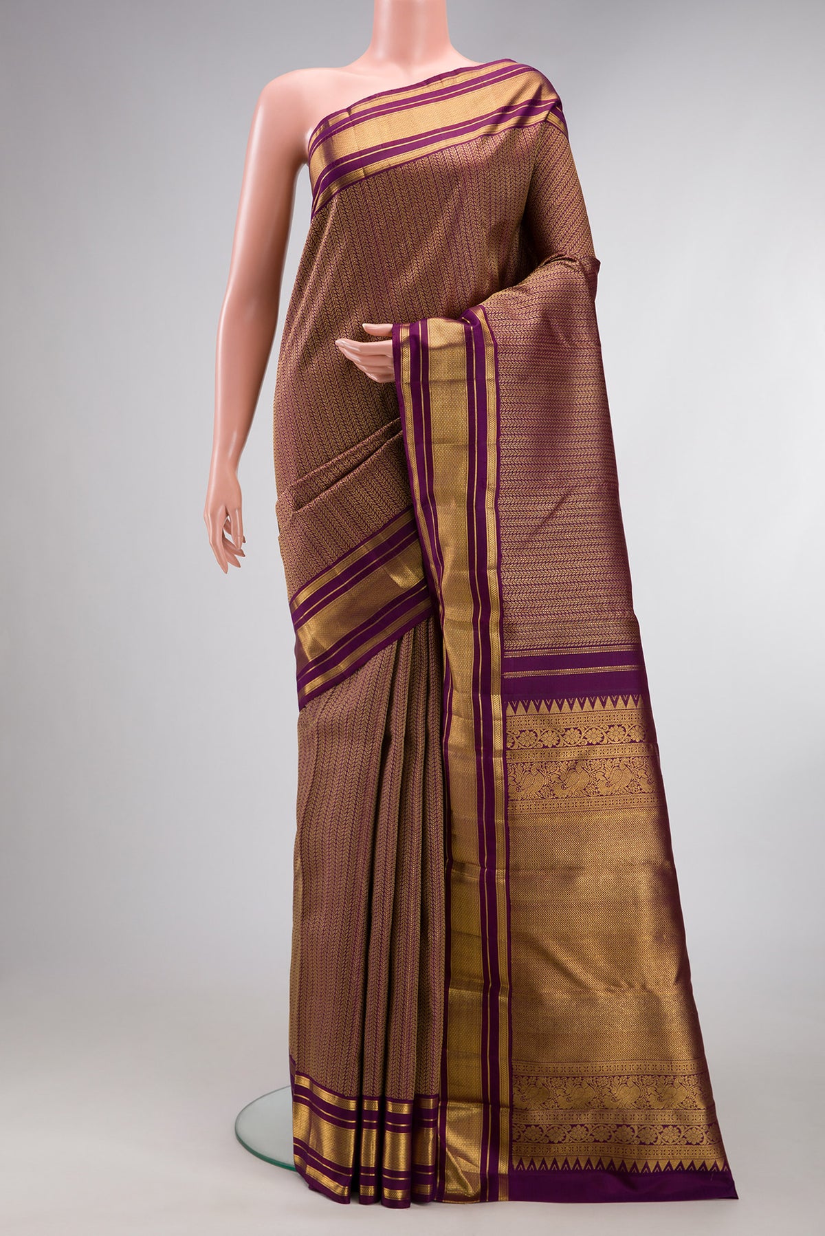 Pure Silk Purple Kanchipuram Saree with Jacquard design on the body and Zari Border.  displayed on a mannequin