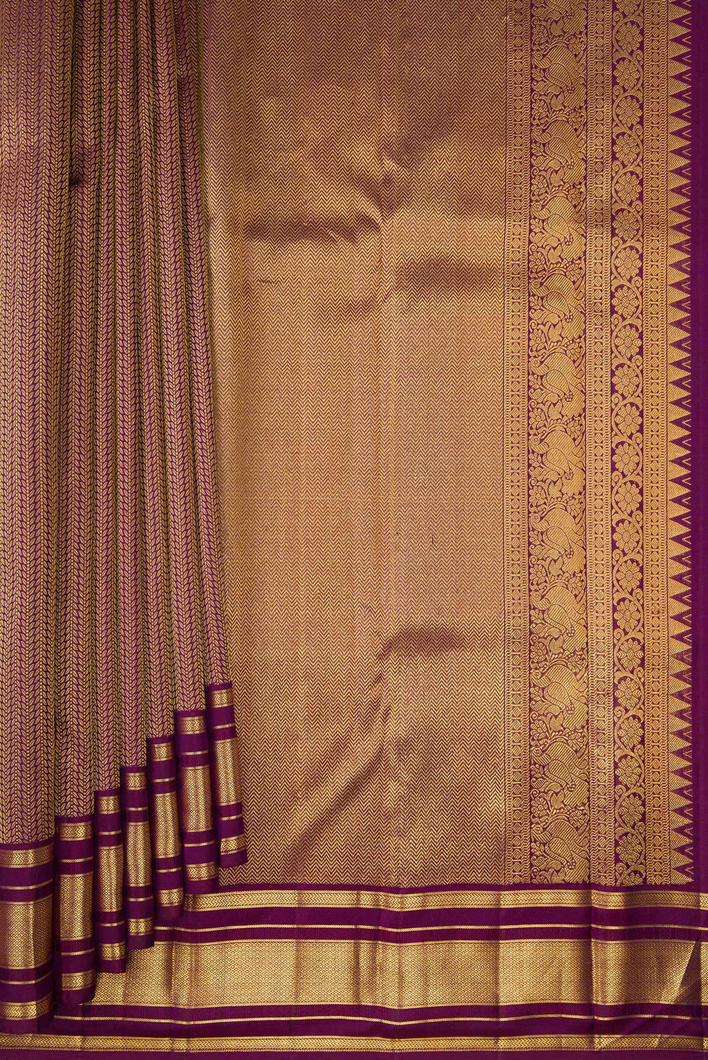 Pleats and pallu of Pure Silk Purple Kanchipuram Saree with Jacquard design on the body and Zari Border. 
