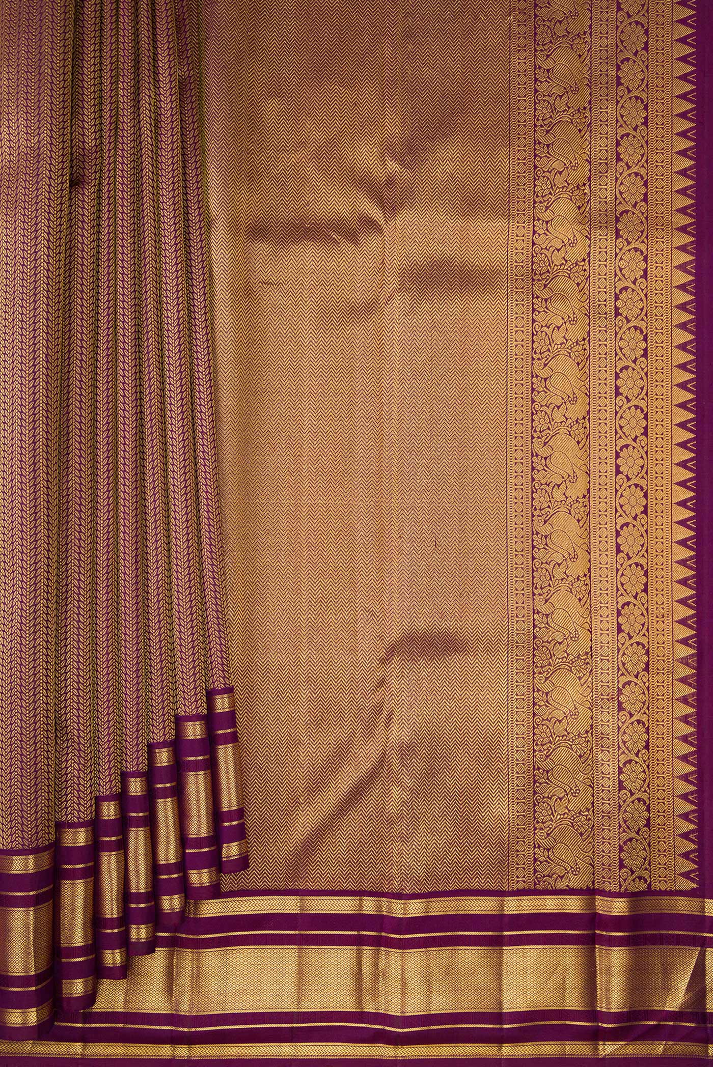 Pleats and pallu of Pure Silk Purple Kanchipuram Saree with Jacquard design on the body and Zari Border. 