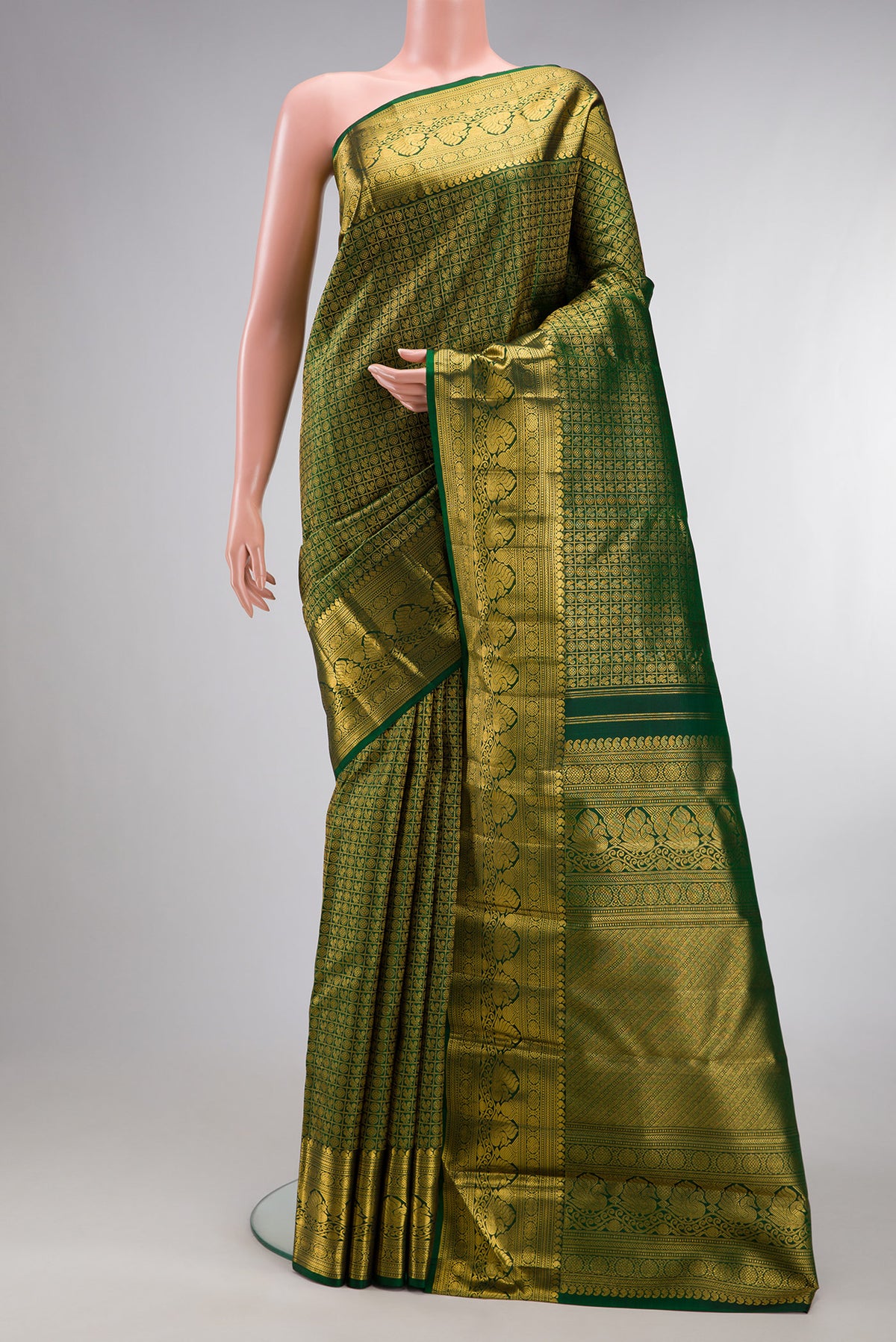 Pure Silk Bottle Green Dual Tone Kanchipuram Saree with Zari Brocade on the body and Zari Border.  displayed on a mannequin