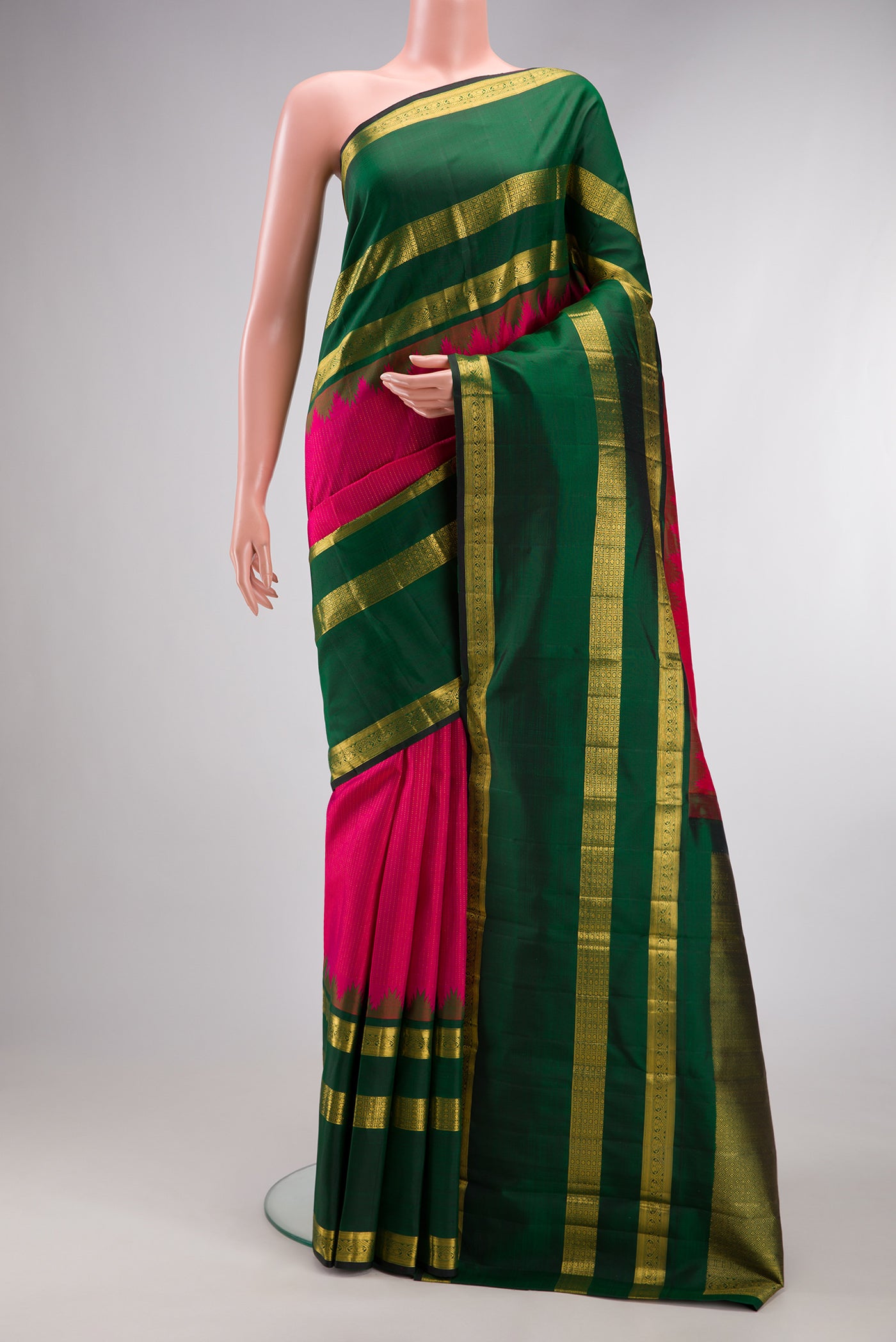 Pink Kanchipuram Silk Saree with Stripes on the body and Zari Border.  displayed on a mannequin