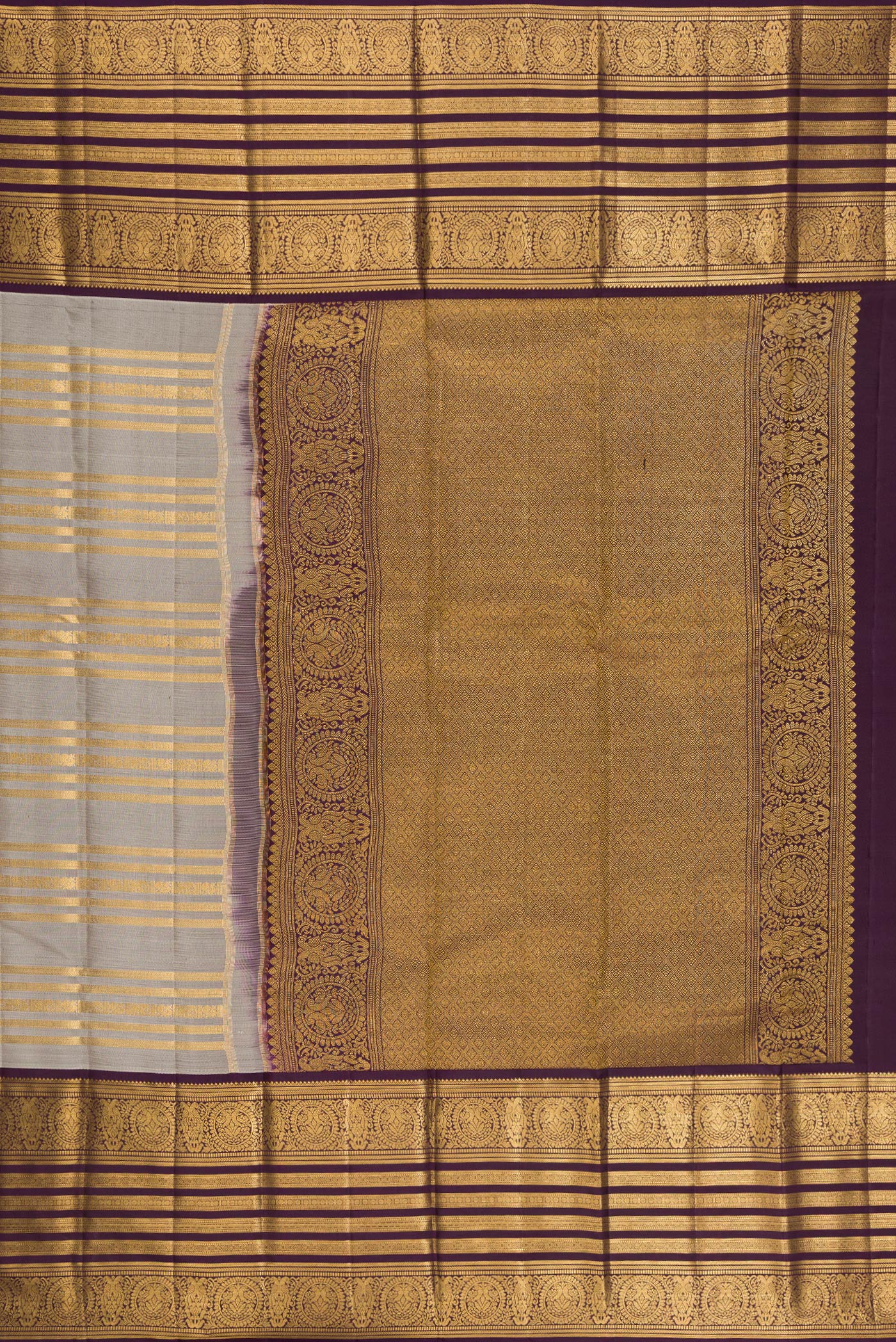 Close up image of the pallu of Grey Kanjivaram Silk Saree with Stripes on the body and Zari Border. 