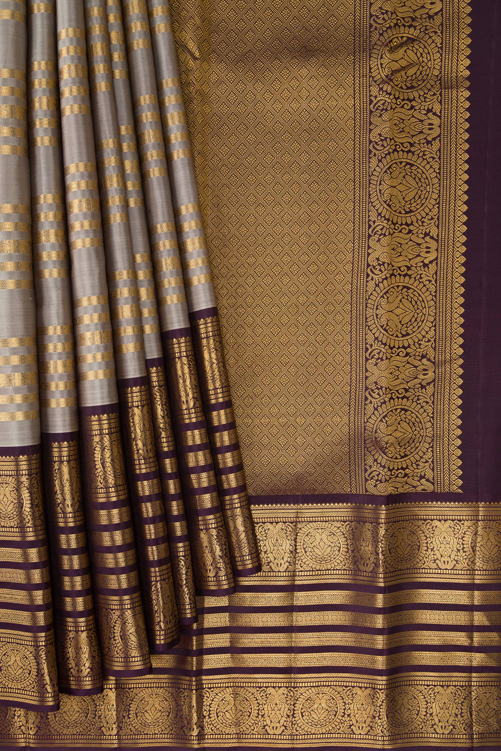 Pleats and pallu of Grey Kanjivaram Silk Saree with Stripes on the body and Zari Border. 