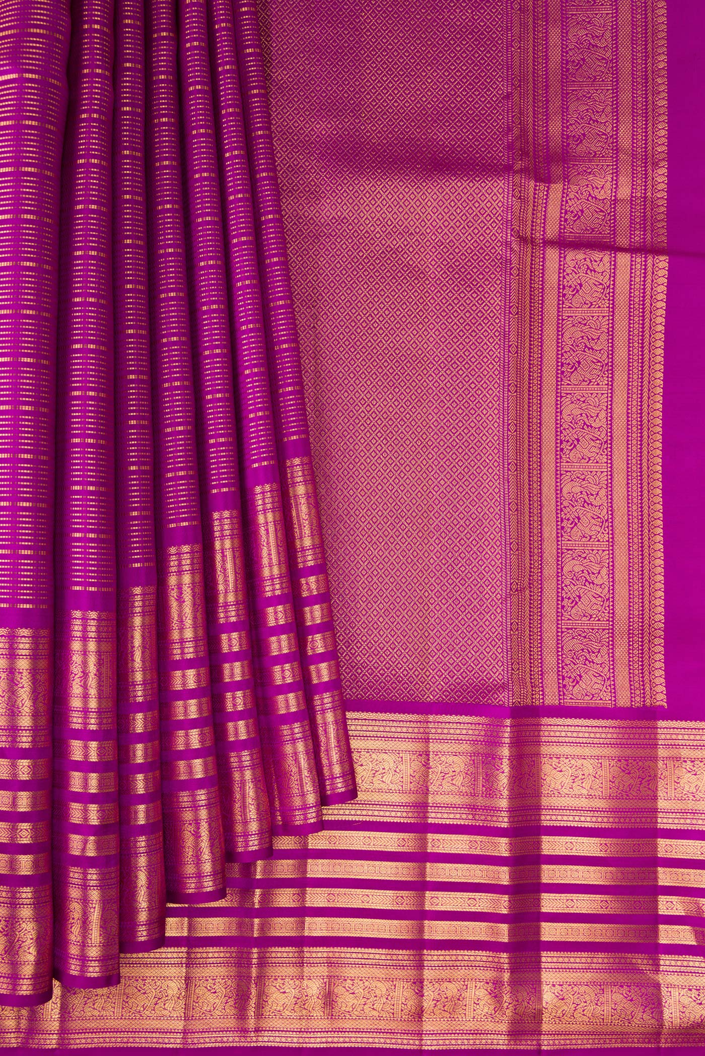 Pleats and pallu of Magenta Kanjivaram Silk Saree with Stripes on the body and Fancy Border. 