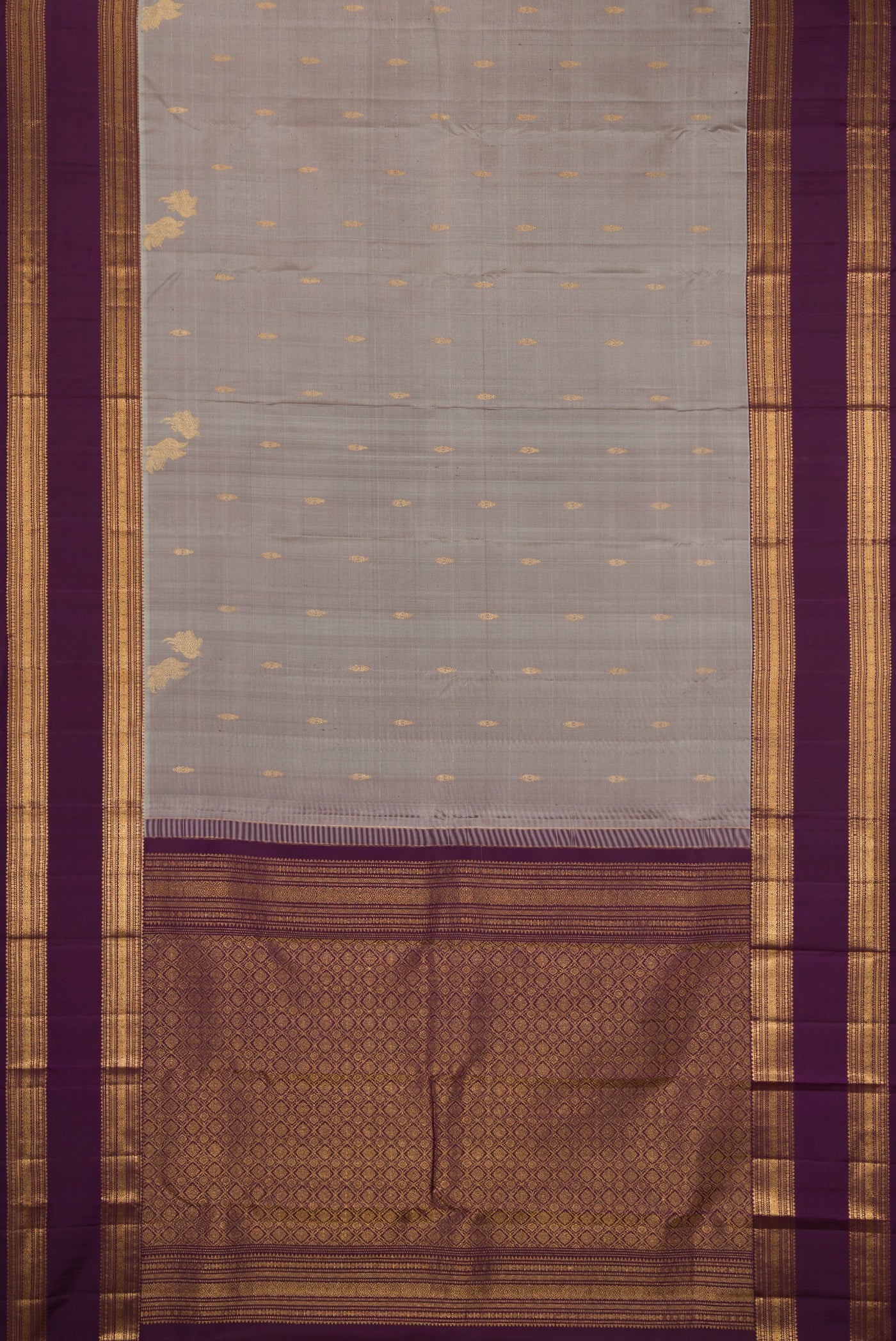 Flat view of Grey Kanjivaram Silk Saree with Zari Butta on the body and Zari Border. 