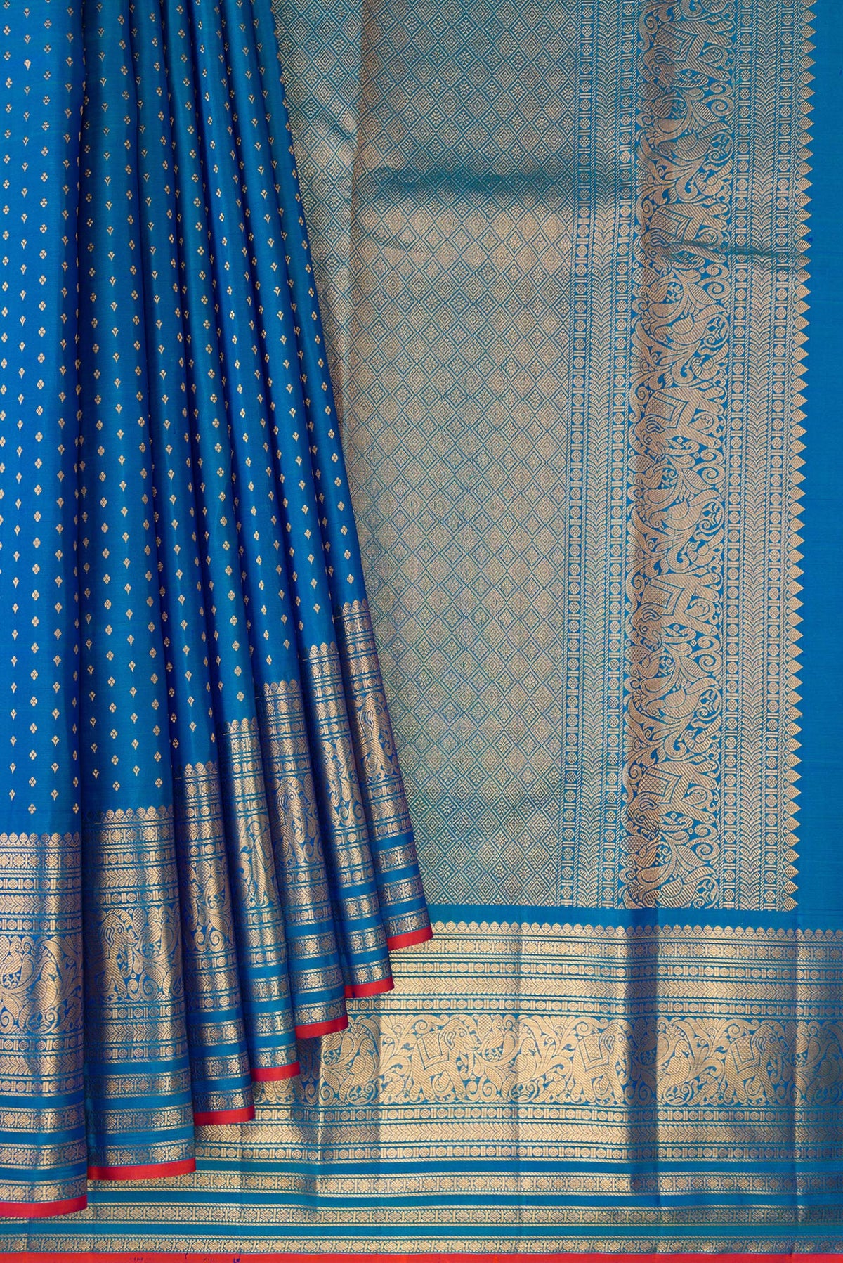 Pleats and pallu of Pure Silk Blue Kanjivaram Saree with Zari Butta on the body and Zari Border. 