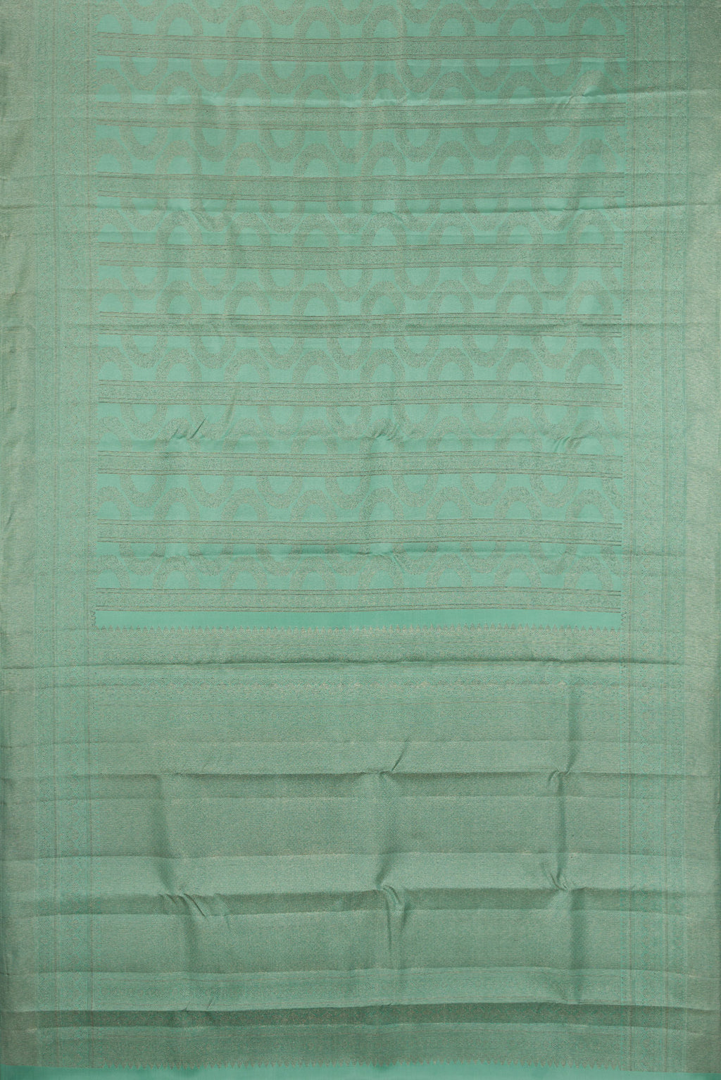 Flat view of Pure Silk Sea Green Kanjivaram Saree with Zari Brocade on the body and Fancy Border. 