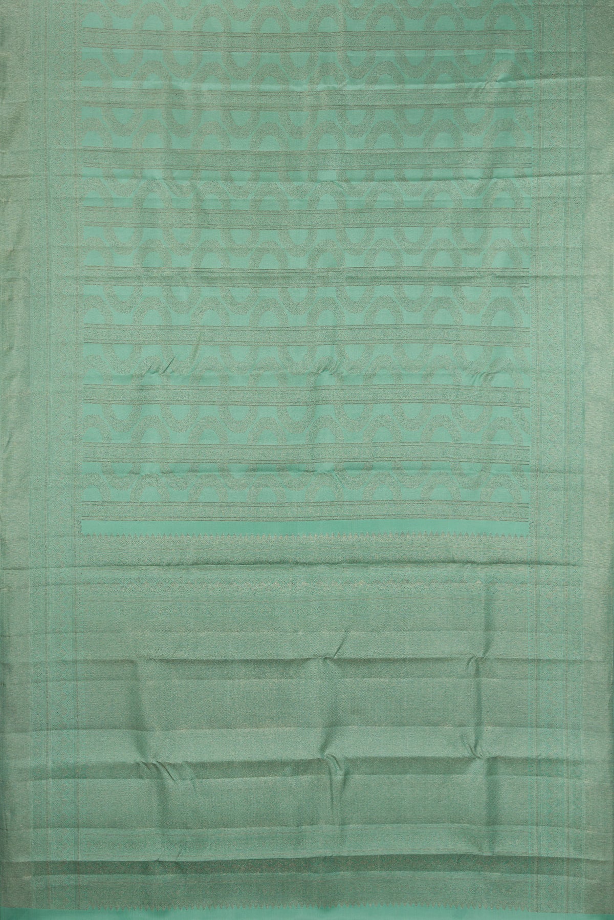 Flat view of Pure Silk Sea Green Kanjivaram Saree with Zari Brocade on the body and Fancy Border. 